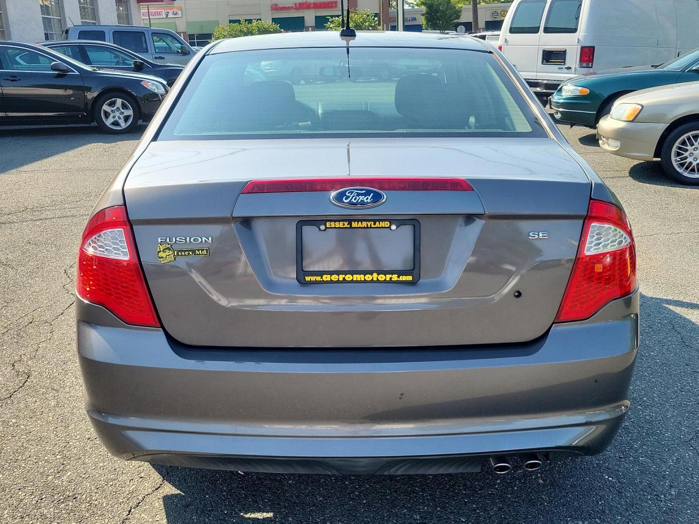 2012 GRAY Ford Fusion SE (3FAHP0HA9CR) with an 2.5L 16V I4 DURATEC ENGINE engine, located at 50 Eastern Blvd., Essex, MD, 21221, (410) 686-3444, 39.304367, -76.484947 - Elevate your driving experience with this 2012 Ford Fusion SE 4dr Sdn SE FWD in a classic gray exterior. Powered by a highly efficient 2.5L 16V I4 Duratec engine, this vehicle promises excellent performance and reliable durability. The Fusion delicately combines sporty dynamism and comfortable luxur - Photo#4