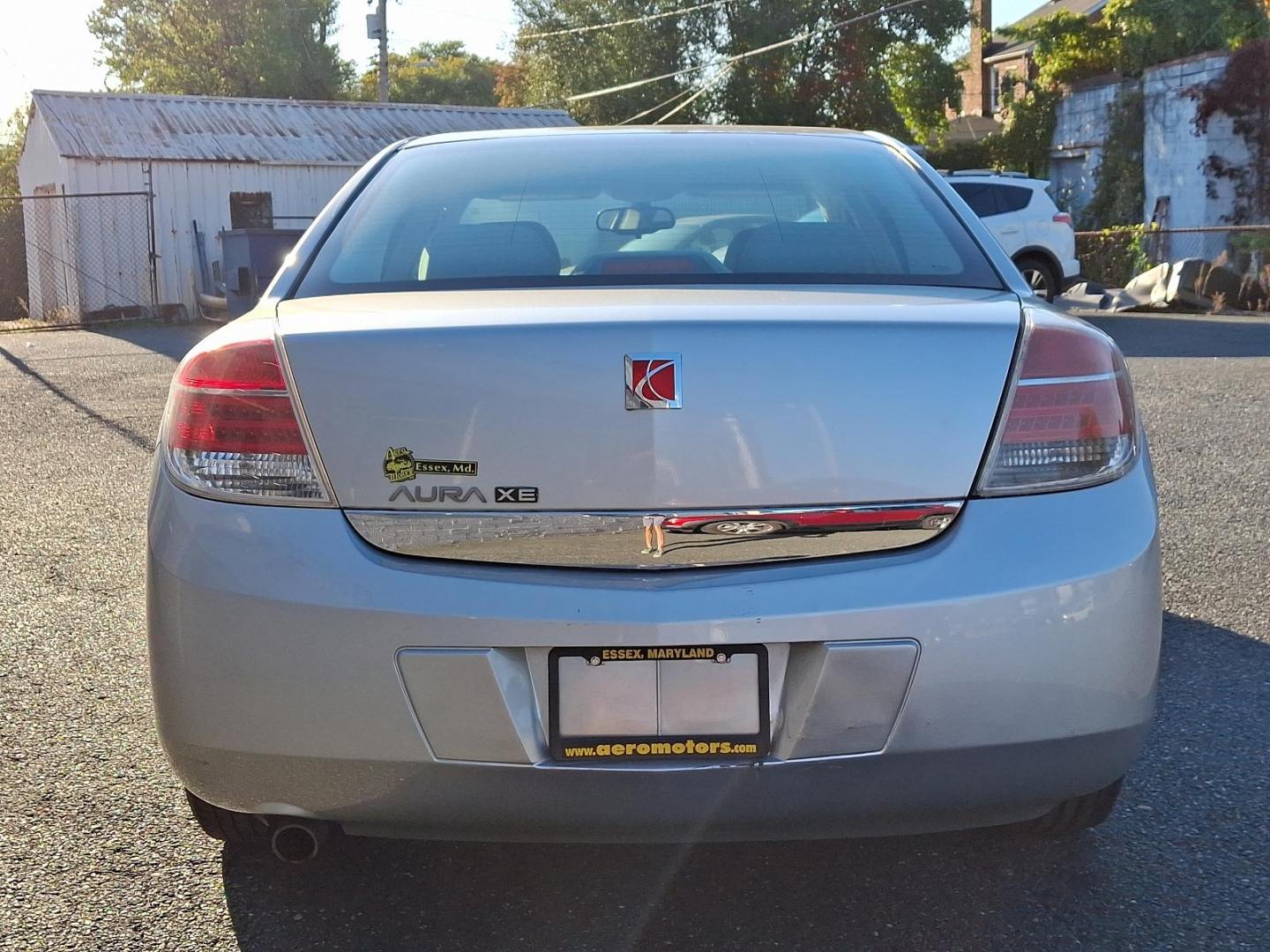 2009 Quicksilver - 17U /Gray - 85B Saturn Aura XE (1G8ZS57B99F) with an ENGINE, ECOTEC 2.4L 4-CYLINDER engine, located at 50 Eastern Blvd., Essex, MD, 21221, (410) 686-3444, 39.304367, -76.484947 - Step into the driver's seat of this sophisticated 2009 Saturn Aura XE 4dr Sdn I4 XE, an epitome of sleek design and reliable performance. Coated in an enchanting Quicksilver exterior perfectly contrasted with a nearly untouched Gray interior, this vehicle promises an exemplary blend of style and com - Photo#4