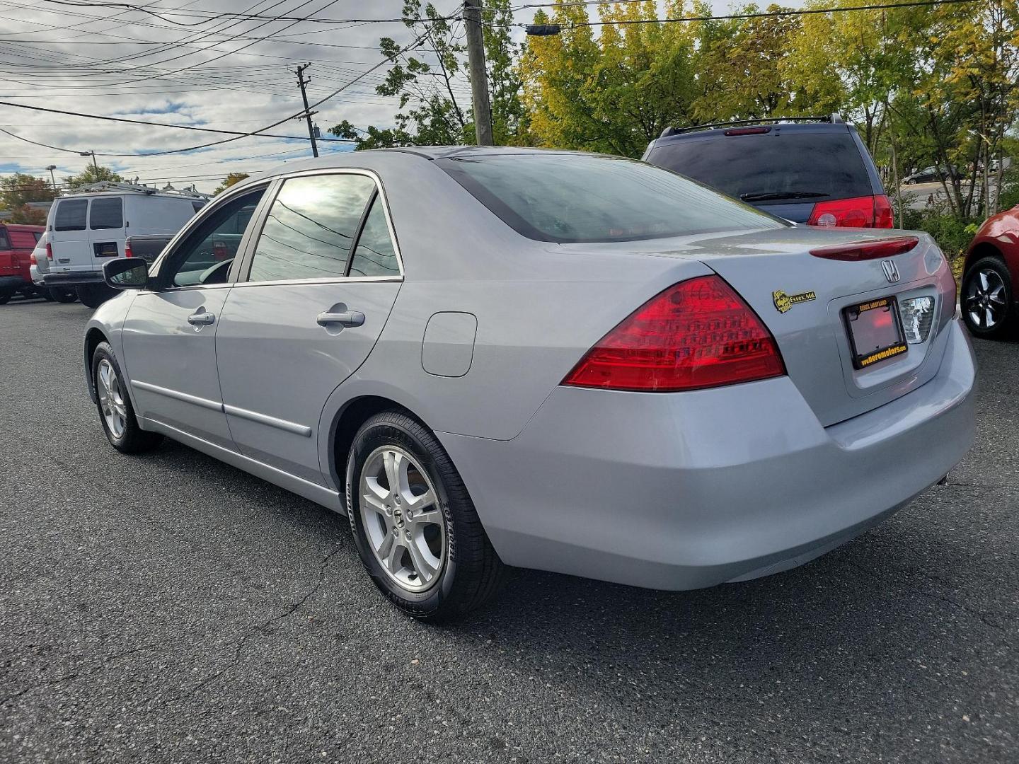 2006 Alabaster Silver Metallic - SI /Black - BK Honda Accord Sdn EX (1HGCM56766A) with an 2.4L DOHC MPFI 16-valve i-VTEC I4 engine engine, located at 50 Eastern Blvd., Essex, MD, 21221, (410) 686-3444, 39.304367, -76.484947 - Experience the synergy of comfort and reliability with this 2006 Honda Accord sedan. Dressed in a sleek silver exterior, this beauty exudes sophistication during every journey. While specific interior details are undefined, Honda is renowned for creating comfortable, highly-functional and user-frien - Photo#5