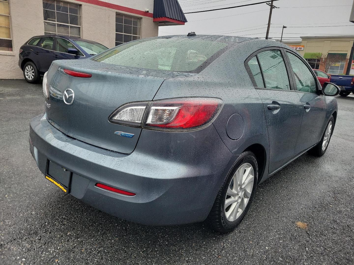 2012 Dolphin Gray Mica - 39T /Black - BU4 Mazda Mazda3 i Grand Touring (JM1BL1W88C1) with an 2.0L DOHC 16-valve SKYACTIV-G I4 engine -inc: variable valve timing (VVT) engine, located at 50 Eastern Blvd., Essex, MD, 21221, (410) 686-3444, 39.304367, -76.484947 - Discover the thrilling ride of the 2012 Mazda Mazda3 i Grand Touring 4dr Sedan Auto i Grand Touring. This vehicle showcases a sleek Dolphin Gray Mica-39T exterior, elegantly complemented by a sophisticated Black-BU4 interior that underlines its timeless appeal. Under the hood, you'll find the robust - Photo#3