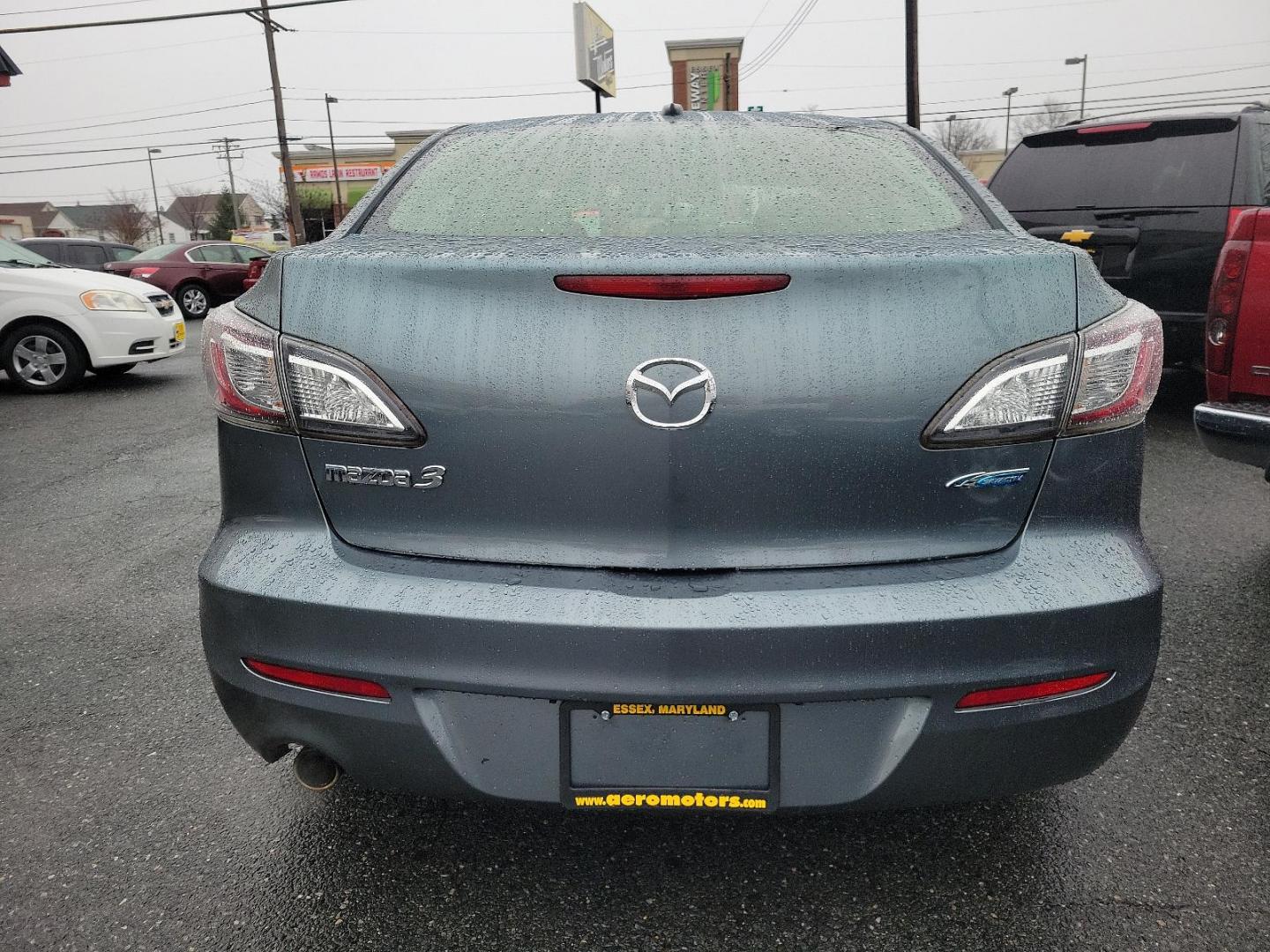 2012 Dolphin Gray Mica - 39T /Black - BU4 Mazda Mazda3 i Grand Touring (JM1BL1W88C1) with an 2.0L DOHC 16-valve SKYACTIV-G I4 engine -inc: variable valve timing (VVT) engine, located at 50 Eastern Blvd., Essex, MD, 21221, (410) 686-3444, 39.304367, -76.484947 - Discover the thrilling ride of the 2012 Mazda Mazda3 i Grand Touring 4dr Sedan Auto i Grand Touring. This vehicle showcases a sleek Dolphin Gray Mica-39T exterior, elegantly complemented by a sophisticated Black-BU4 interior that underlines its timeless appeal. Under the hood, you'll find the robust - Photo#4