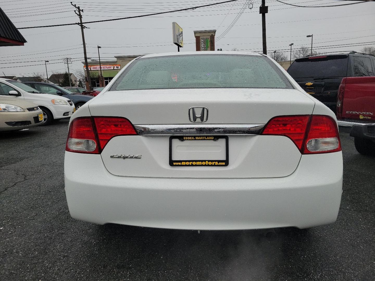 2011 Taffeta White - WH /Gray - GR Honda Civic Sdn EX (2HGFA1F85BH) with an 1.8L SOHC MPFI 16-valve i-VTEC I4 engine engine, located at 50 Eastern Blvd., Essex, MD, 21221, (410) 686-3444, 39.304367, -76.484947 - Experience style, performance, and value with this 2011 Honda Civic Sdn. Coated in a sleek white exterior, this Honda Civic articulates class and sophistication. A beacon of efficiency, it offers powerful performance while still delivering impressive fuel efficiency. Detailed with a well-maintained - Photo#4