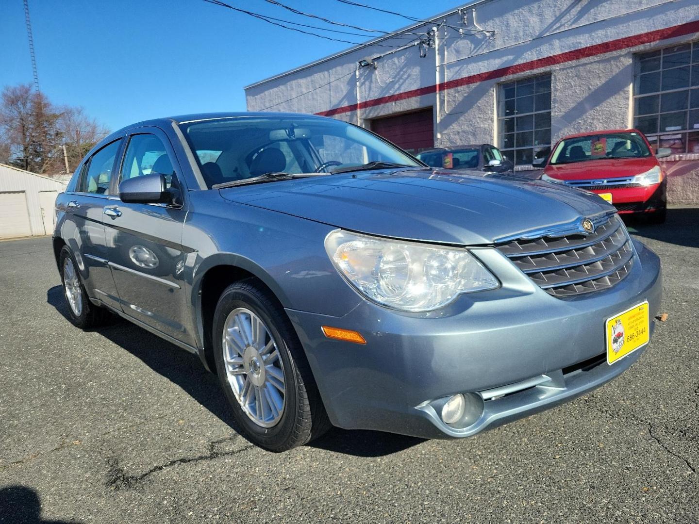 2007 Silver Steel Metallic - PA4 /Dark/Light Slate Gray - DB Chrysler Sebring Sdn Limited (1C3LC66K57N) with an 2.4L SMPI DOHC 16-VALVE I4 DUAL VVT ENGINE engine, located at 50 Eastern Blvd., Essex, MD, 21221, (410) 686-3444, 39.304367, -76.484947 - Discover the perfect blend of style, comfort and performance with this 2007 Chrysler Sebring Sdn Limited 4dr. Finished in an alluring Silver Steel Metallic - PA4 exterior paired beautifully with the plush Dark/Light Slate Gray - DB interior, it exhibits a sleek, chic aesthetic that's sure to turn he - Photo#2