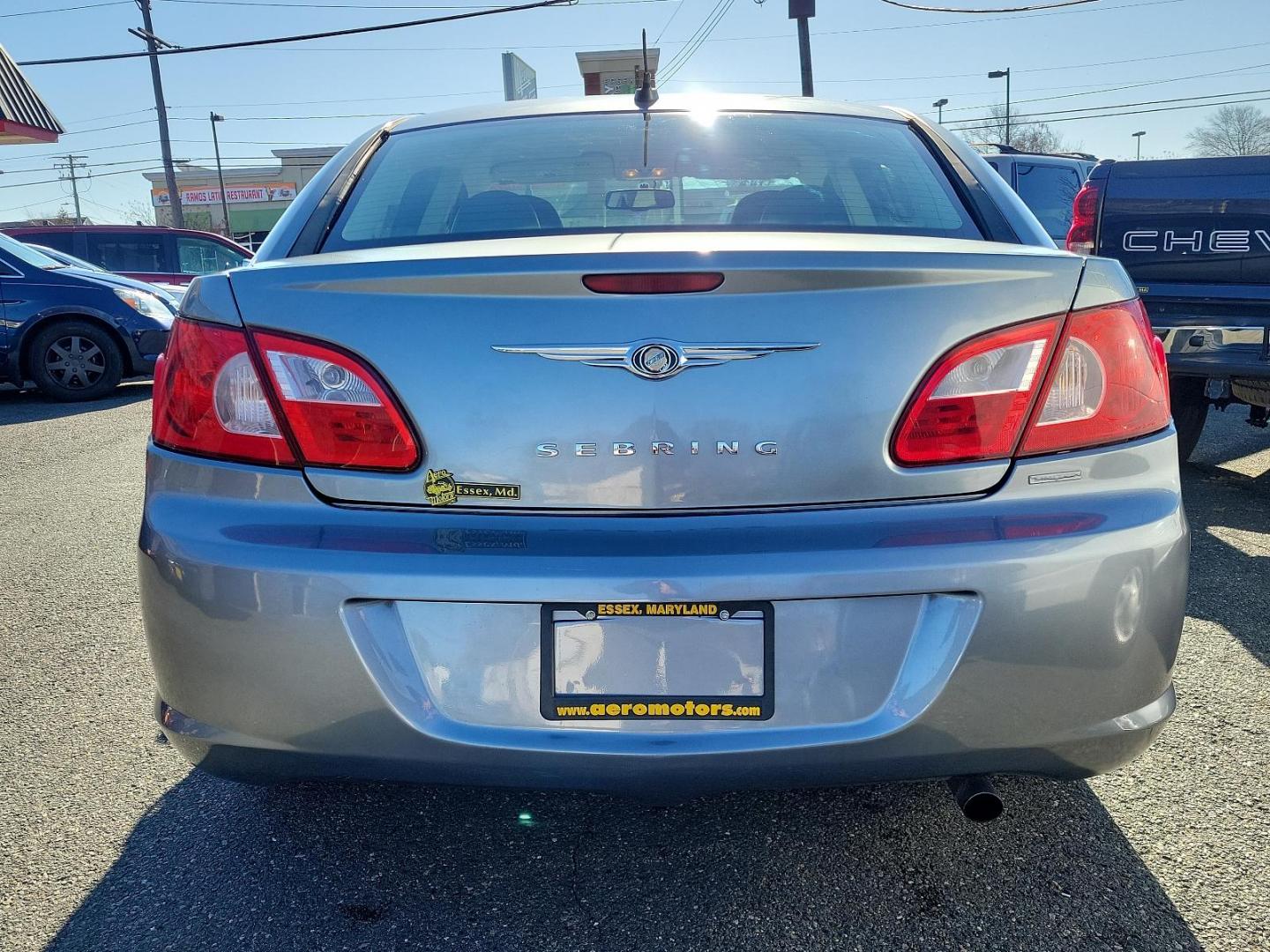 2007 Silver Steel Metallic - PA4 /Dark/Light Slate Gray - DB Chrysler Sebring Sdn Limited (1C3LC66K57N) with an 2.4L SMPI DOHC 16-VALVE I4 DUAL VVT ENGINE engine, located at 50 Eastern Blvd., Essex, MD, 21221, (410) 686-3444, 39.304367, -76.484947 - Discover the perfect blend of style, comfort and performance with this 2007 Chrysler Sebring Sdn Limited 4dr. Finished in an alluring Silver Steel Metallic - PA4 exterior paired beautifully with the plush Dark/Light Slate Gray - DB interior, it exhibits a sleek, chic aesthetic that's sure to turn he - Photo#4