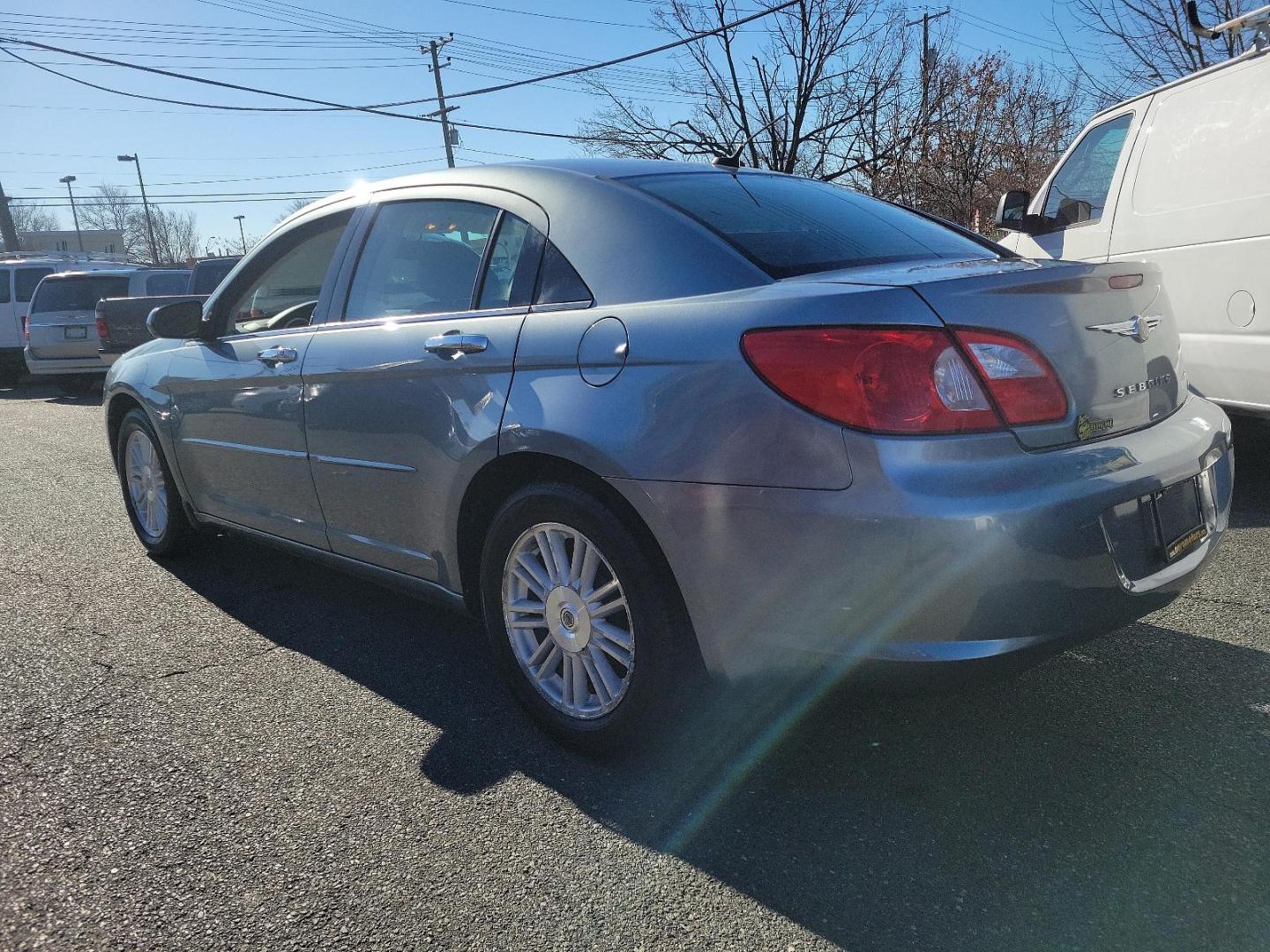 2007 Silver Steel Metallic - PA4 /Dark/Light Slate Gray - DB Chrysler Sebring Sdn Limited (1C3LC66K57N) with an 2.4L SMPI DOHC 16-VALVE I4 DUAL VVT ENGINE engine, located at 50 Eastern Blvd., Essex, MD, 21221, (410) 686-3444, 39.304367, -76.484947 - Discover the perfect blend of style, comfort and performance with this 2007 Chrysler Sebring Sdn Limited 4dr. Finished in an alluring Silver Steel Metallic - PA4 exterior paired beautifully with the plush Dark/Light Slate Gray - DB interior, it exhibits a sleek, chic aesthetic that's sure to turn he - Photo#5