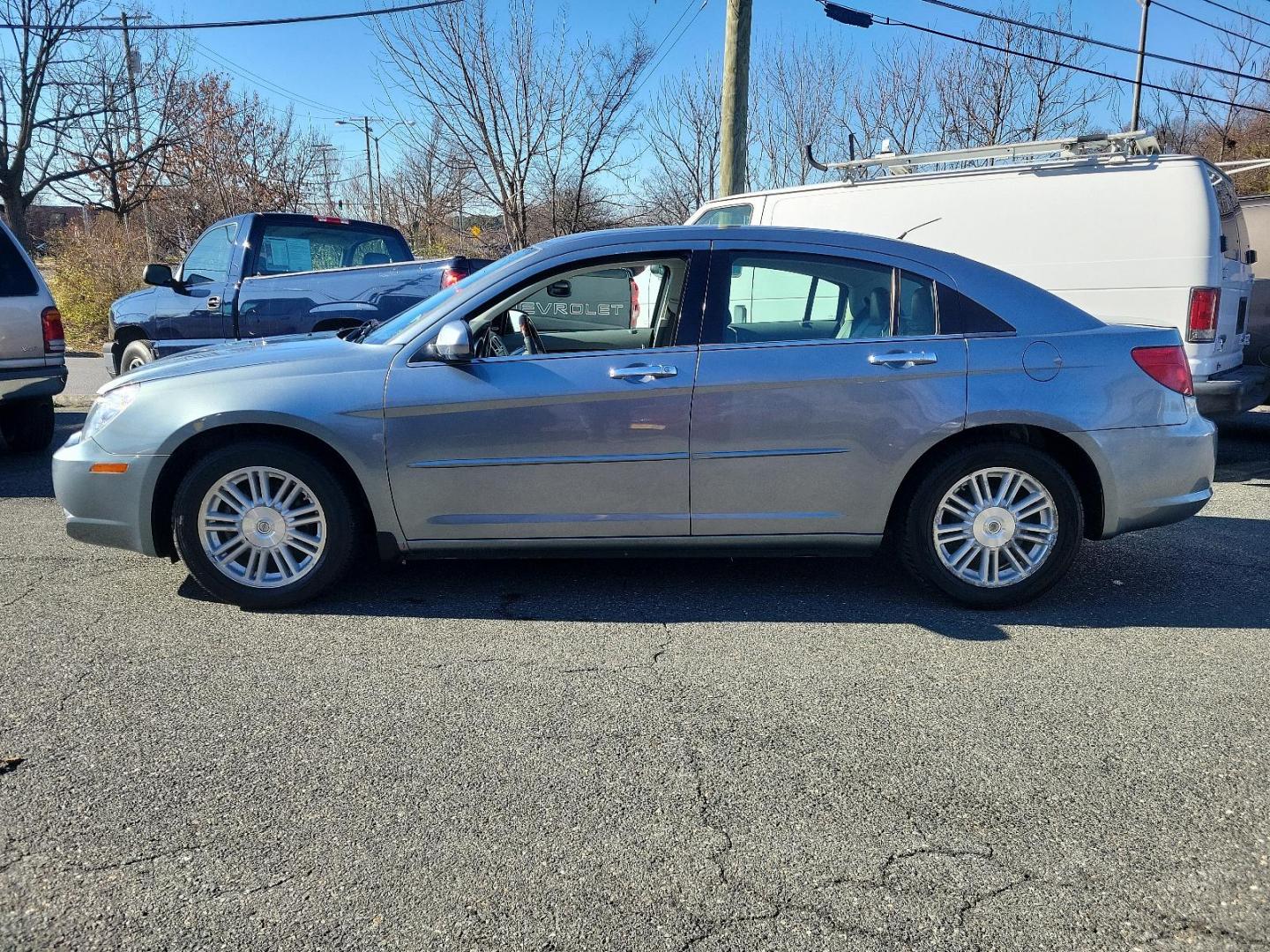 2007 Silver Steel Metallic - PA4 /Dark/Light Slate Gray - DB Chrysler Sebring Sdn Limited (1C3LC66K57N) with an 2.4L SMPI DOHC 16-VALVE I4 DUAL VVT ENGINE engine, located at 50 Eastern Blvd., Essex, MD, 21221, (410) 686-3444, 39.304367, -76.484947 - Discover the perfect blend of style, comfort and performance with this 2007 Chrysler Sebring Sdn Limited 4dr. Finished in an alluring Silver Steel Metallic - PA4 exterior paired beautifully with the plush Dark/Light Slate Gray - DB interior, it exhibits a sleek, chic aesthetic that's sure to turn he - Photo#6