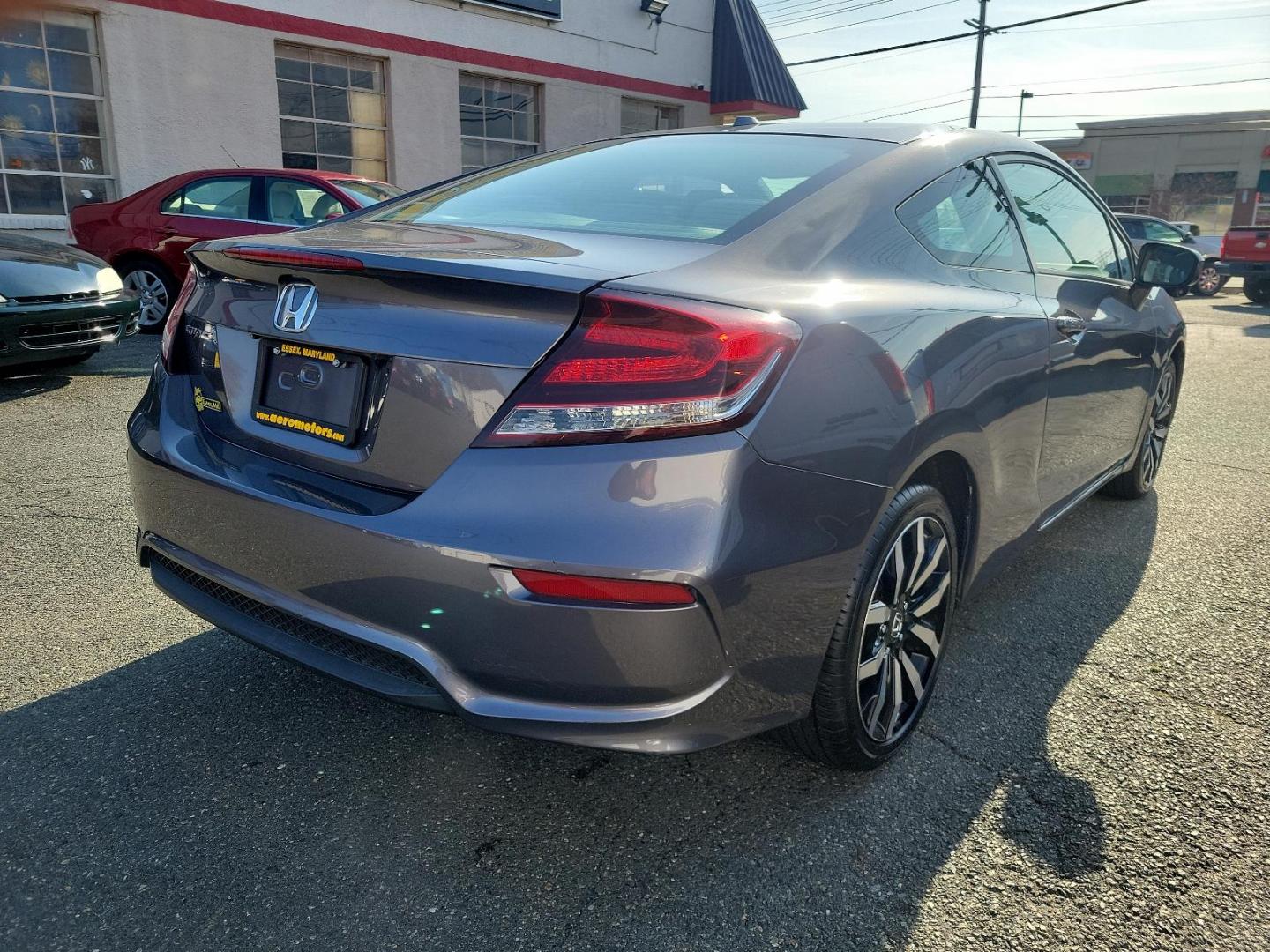 2015 Modern Steel Metallic - GX /Gray - GR Honda Civic Coupe EX-L (2HGFG3B05FH) with an Engine: 1.8L I-4 SOHC 16-Valve i-VTEC engine, located at 50 Eastern Blvd., Essex, MD, 21221, (410) 686-3444, 39.304367, -76.484947 - Experience superior performance and stylish comfort with the 2015 Honda Civic Coupe EX-L. Dressed elegantly in a modern steel metallic GX exterior, this coupe boasts a slick design that never goes unnoticed. Its inviting interior is swathed in refined gray tones, presenting a harmonious blend of sty - Photo#3