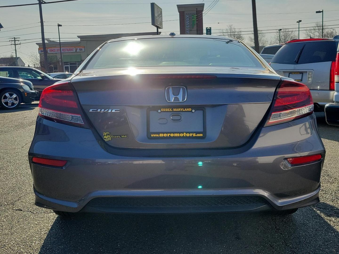 2015 Modern Steel Metallic - GX /Gray - GR Honda Civic Coupe EX-L (2HGFG3B05FH) with an Engine: 1.8L I-4 SOHC 16-Valve i-VTEC engine, located at 50 Eastern Blvd., Essex, MD, 21221, (410) 686-3444, 39.304367, -76.484947 - Experience superior performance and stylish comfort with the 2015 Honda Civic Coupe EX-L. Dressed elegantly in a modern steel metallic GX exterior, this coupe boasts a slick design that never goes unnoticed. Its inviting interior is swathed in refined gray tones, presenting a harmonious blend of sty - Photo#4