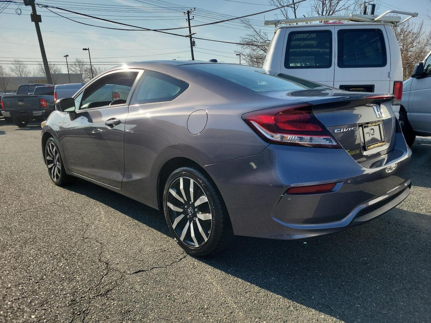 2015 Modern Steel Metallic - GX /Gray - GR Honda Civic Coupe EX-L (2HGFG3B05FH) with an Engine: 1.8L I-4 SOHC 16-Valve i-VTEC engine, located at 50 Eastern Blvd., Essex, MD, 21221, (410) 686-3444, 39.304367, -76.484947 - Experience superior performance and stylish comfort with the 2015 Honda Civic Coupe EX-L. Dressed elegantly in a modern steel metallic GX exterior, this coupe boasts a slick design that never goes unnoticed. Its inviting interior is swathed in refined gray tones, presenting a harmonious blend of sty - Photo#5