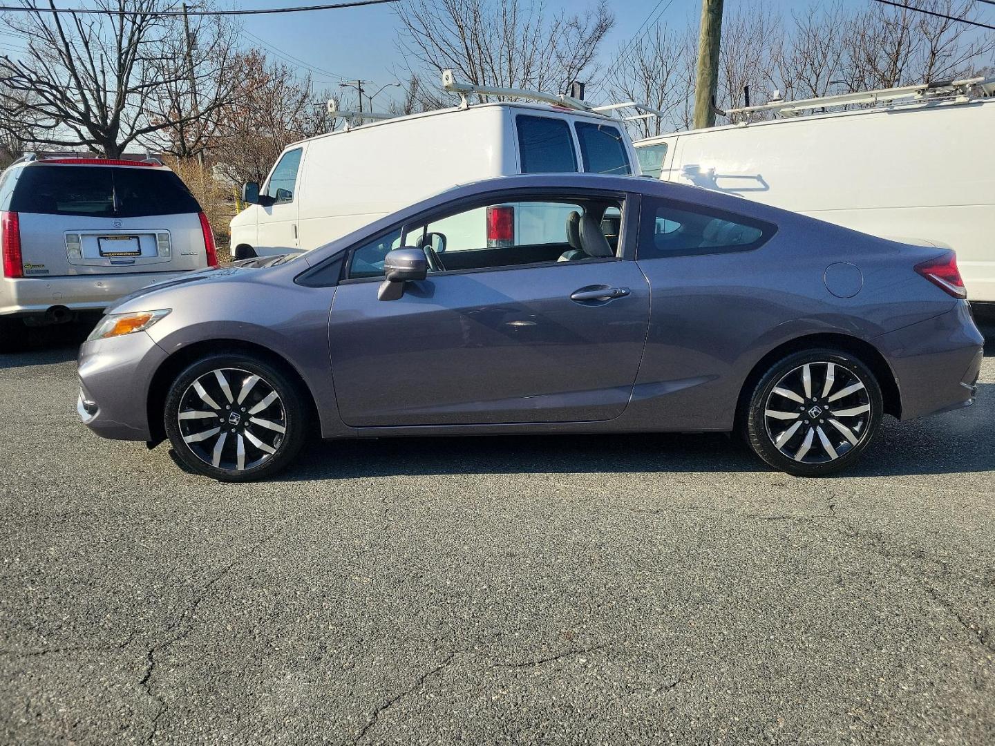 2015 Modern Steel Metallic - GX /Gray - GR Honda Civic Coupe EX-L (2HGFG3B05FH) with an Engine: 1.8L I-4 SOHC 16-Valve i-VTEC engine, located at 50 Eastern Blvd., Essex, MD, 21221, (410) 686-3444, 39.304367, -76.484947 - Experience superior performance and stylish comfort with the 2015 Honda Civic Coupe EX-L. Dressed elegantly in a modern steel metallic GX exterior, this coupe boasts a slick design that never goes unnoticed. Its inviting interior is swathed in refined gray tones, presenting a harmonious blend of sty - Photo#6