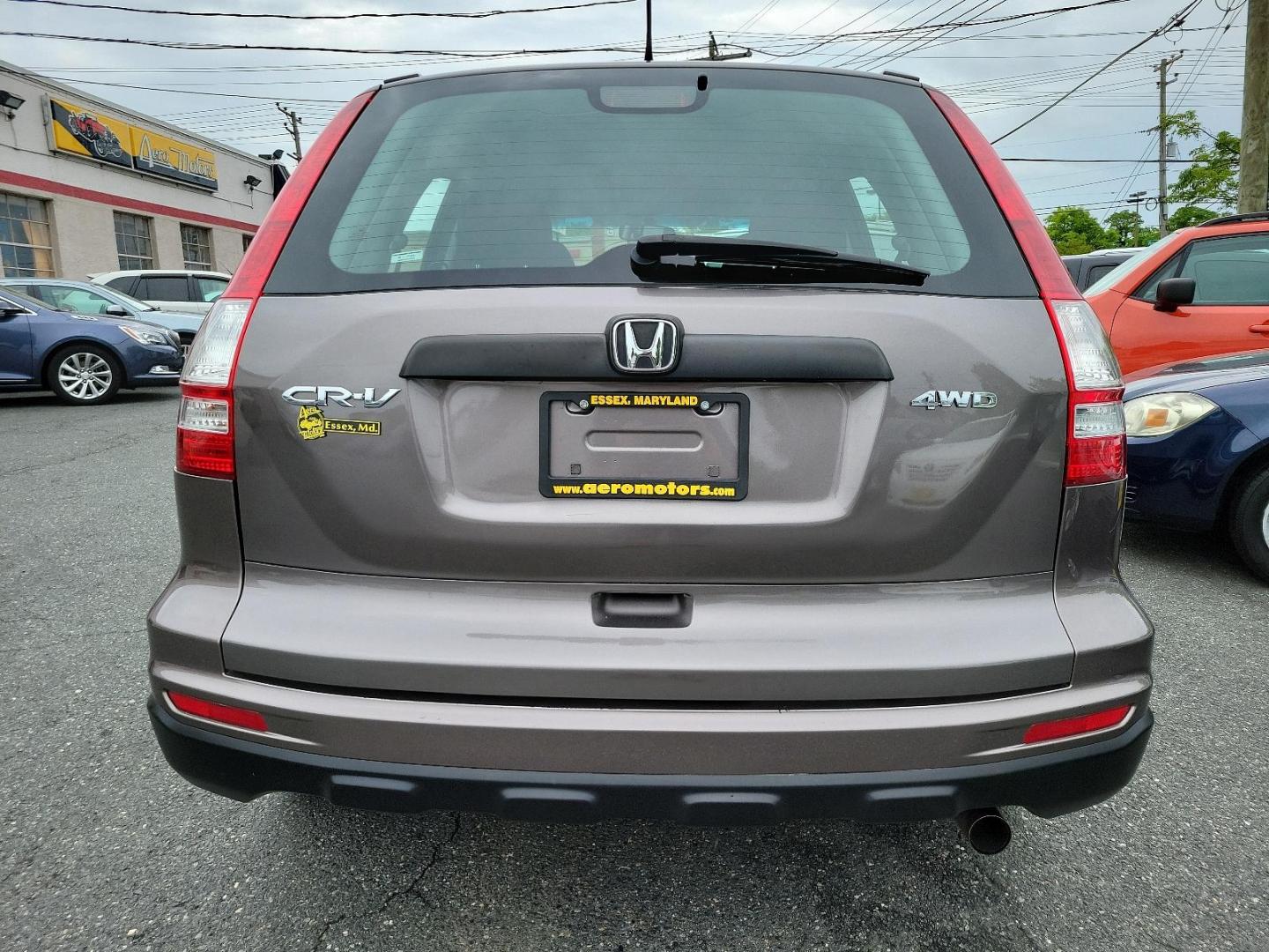 2010 Urban Titanium Metallic - BR /Black - BK Honda CR-V LX (5J6RE4H3XAL) with an 2.4L DOHC MPFI 16-valve i-VTEC I4 engine engine, located at 50 Eastern Blvd., Essex, MD, 21221, (410) 686-3444, 39.304367, -76.484947 - Unleash the power of versatility with this 2010 Honda CR-V LX 4WD. Dressed in an Urban Titanium Metallic exterior and a sleek Black interior, this car embodies style and sophistication. Under the hood, you'll find a robust 2.4L DOHC MPFI 16-Valve i-VTEC I4 engine that delivers dynamic performance an - Photo#4