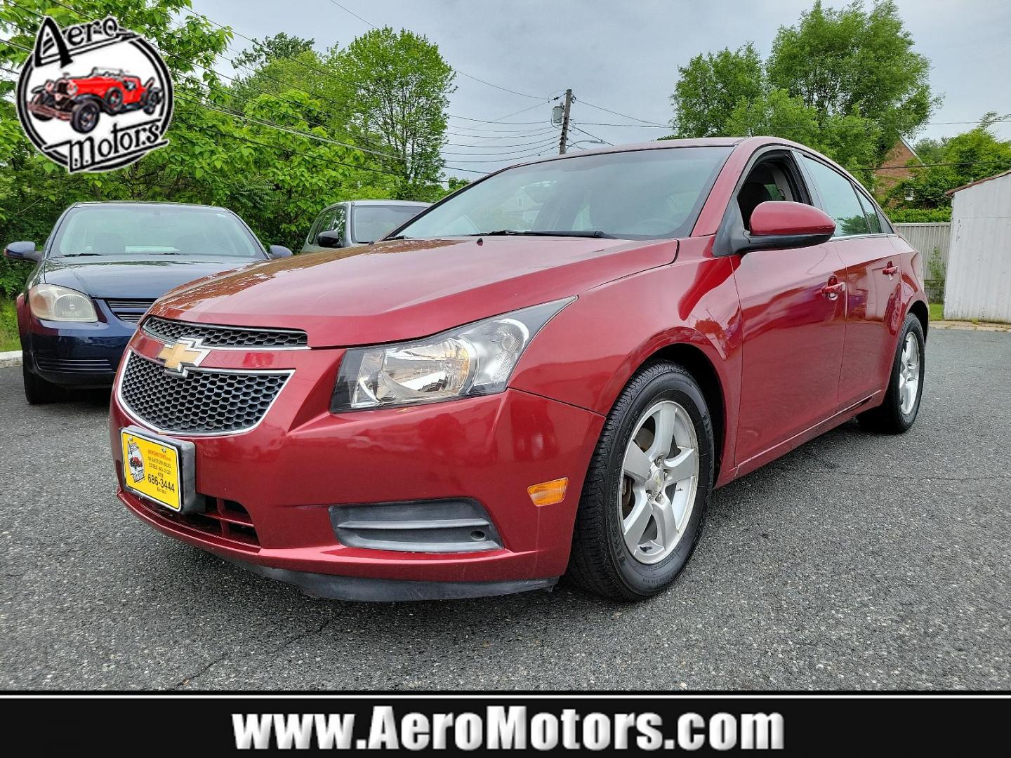 2011 Crystal Red Metallic Tintcoat - GBE /Jet Black/Sport Red - ABY Chevrolet Cruze LT w/1LT (1G1PF5S95B7) with an ENGINE, ECOTEC TURBO 1.4L VARIABLE VALVE TIMING DOHC 4-CYLINDER SEQUENTIAL MFI, TURBO engine, located at 50 Eastern Blvd., Essex, MD, 21221, (410) 686-3444, 39.304367, -76.484947 - Experience the premium blend of performance and style in this 2011 Chevrolet Cruze LT w/1LT 4dr sdn lt w/1lt. Captivating in a striking crystal red metallic tintcoat - GBE exterior, this luxury sedan boasts a stylish Jet Black/Sport Red - ABY interior that exudes sophistication. Powered by an ECOTEC - Photo#0