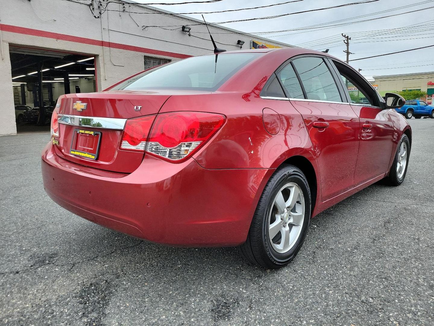 2011 Crystal Red Metallic Tintcoat - GBE /Jet Black/Sport Red - ABY Chevrolet Cruze LT w/1LT (1G1PF5S95B7) with an ENGINE, ECOTEC TURBO 1.4L VARIABLE VALVE TIMING DOHC 4-CYLINDER SEQUENTIAL MFI, TURBO engine, located at 50 Eastern Blvd., Essex, MD, 21221, (410) 686-3444, 39.304367, -76.484947 - Experience the premium blend of performance and style in this 2011 Chevrolet Cruze LT w/1LT 4dr sdn lt w/1lt. Captivating in a striking crystal red metallic tintcoat - GBE exterior, this luxury sedan boasts a stylish Jet Black/Sport Red - ABY interior that exudes sophistication. Powered by an ECOTEC - Photo#3