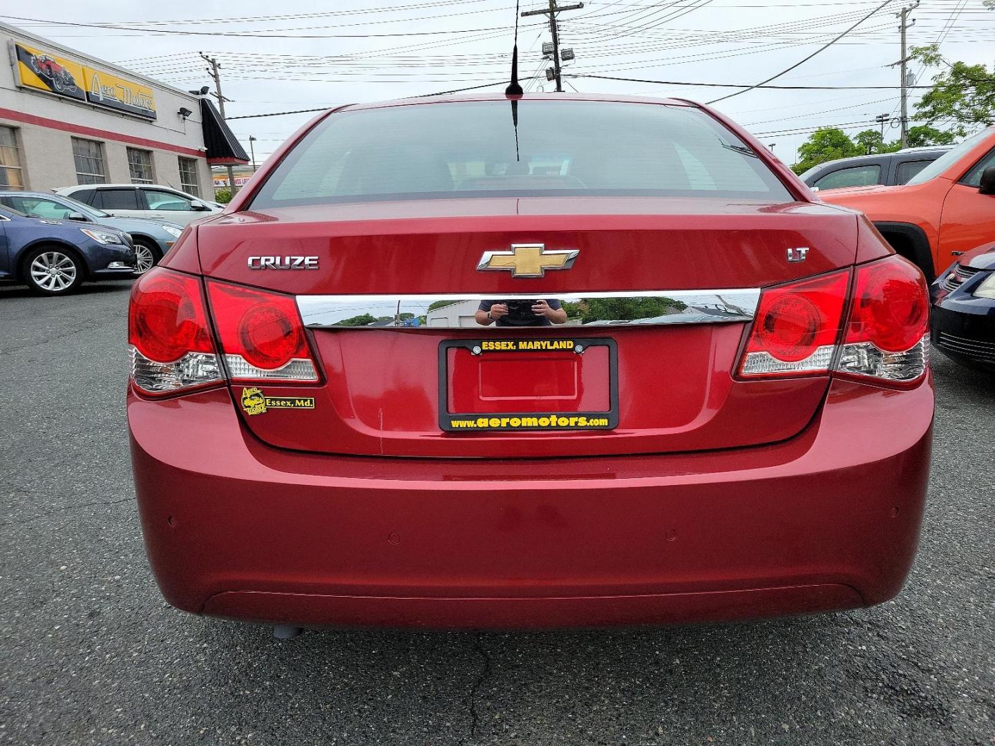 2011 Crystal Red Metallic Tintcoat - GBE /Jet Black/Sport Red - ABY Chevrolet Cruze LT w/1LT (1G1PF5S95B7) with an ENGINE, ECOTEC TURBO 1.4L VARIABLE VALVE TIMING DOHC 4-CYLINDER SEQUENTIAL MFI, TURBO engine, located at 50 Eastern Blvd., Essex, MD, 21221, (410) 686-3444, 39.304367, -76.484947 - Experience the premium blend of performance and style in this 2011 Chevrolet Cruze LT w/1LT 4dr sdn lt w/1lt. Captivating in a striking crystal red metallic tintcoat - GBE exterior, this luxury sedan boasts a stylish Jet Black/Sport Red - ABY interior that exudes sophistication. Powered by an ECOTEC - Photo#4