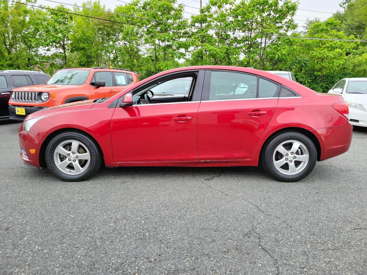 2011 Crystal Red Metallic Tintcoat - GBE /Jet Black/Sport Red - ABY Chevrolet Cruze LT w/1LT (1G1PF5S95B7) with an ENGINE, ECOTEC TURBO 1.4L VARIABLE VALVE TIMING DOHC 4-CYLINDER SEQUENTIAL MFI, TURBO engine, located at 50 Eastern Blvd., Essex, MD, 21221, (410) 686-3444, 39.304367, -76.484947 - Experience the premium blend of performance and style in this 2011 Chevrolet Cruze LT w/1LT 4dr sdn lt w/1lt. Captivating in a striking crystal red metallic tintcoat - GBE exterior, this luxury sedan boasts a stylish Jet Black/Sport Red - ABY interior that exudes sophistication. Powered by an ECOTEC - Photo#6