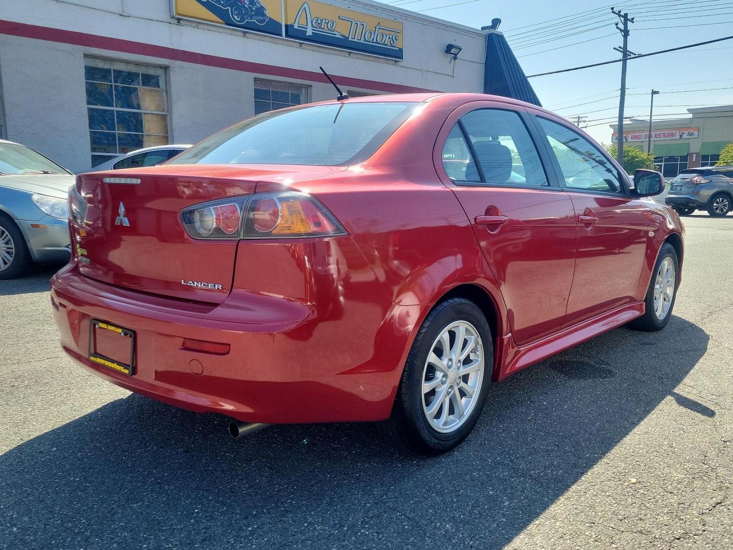 2011 Rally Red Metallic - P26 /Black - 85P Mitsubishi Lancer ES (JA32U2FU9BU) with an 2.0L DOHC MIVEC I4 engine engine, located at 50 Eastern Blvd., Essex, MD, 21221, (410) 686-3444, 39.304367, -76.484947 - Prepare yourself for the exceptional performance and stylish aesthetics of this 2011 Mitsubishi Lancer ES 4dr sdn cvt es fwd. Coated in a captivating Rally Red Metallic - p26 exterior, this Mitsubishi Lancer ES proclaims your discerning taste and eye for sophistication. Indulge in the comfort of its - Photo#3