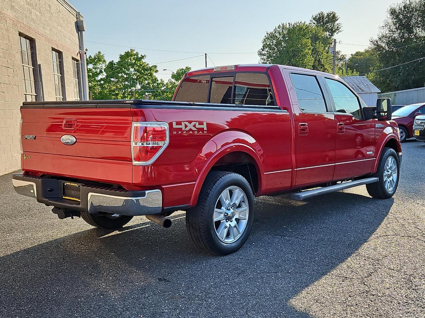 2011 Red Candy Metallic - RZ /Pale Adobe - EA Ford F-150 Lariat (1FTFW1ET9BF) with an 3.5L V6 ECOBOOST ENGINE engine, located at 50 Eastern Blvd., Essex, MD, 21221, (410) 686-3444, 39.304367, -76.484947 - Experience power, comfort and style with this stunning 2011 Ford F-150 Lariat 4WD Supercrew 157" Lariat. Showcasing a striking Red Candy Metallic-RZ exterior paired with a refined Pale Adobe-EA interior, this beast stands as a testament to Ford's superb craftsmanship. Under the hood lies a potent 3. - Photo#3