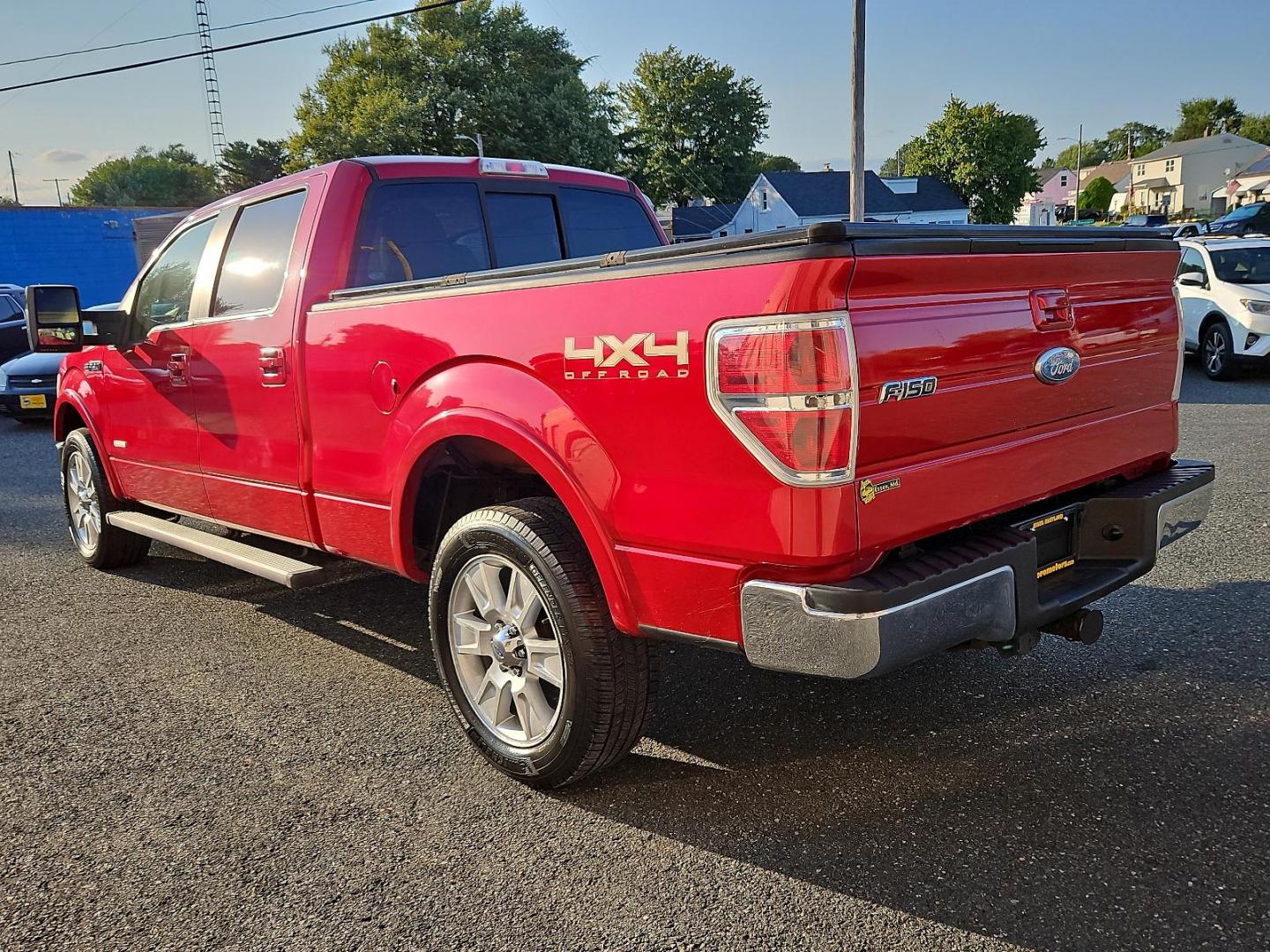 2011 Red Candy Metallic - RZ /Pale Adobe - EA Ford F-150 Lariat (1FTFW1ET9BF) with an 3.5L V6 ECOBOOST ENGINE engine, located at 50 Eastern Blvd., Essex, MD, 21221, (410) 686-3444, 39.304367, -76.484947 - Experience power, comfort and style with this stunning 2011 Ford F-150 Lariat 4WD Supercrew 157" Lariat. Showcasing a striking Red Candy Metallic-RZ exterior paired with a refined Pale Adobe-EA interior, this beast stands as a testament to Ford's superb craftsmanship. Under the hood lies a potent 3. - Photo#5