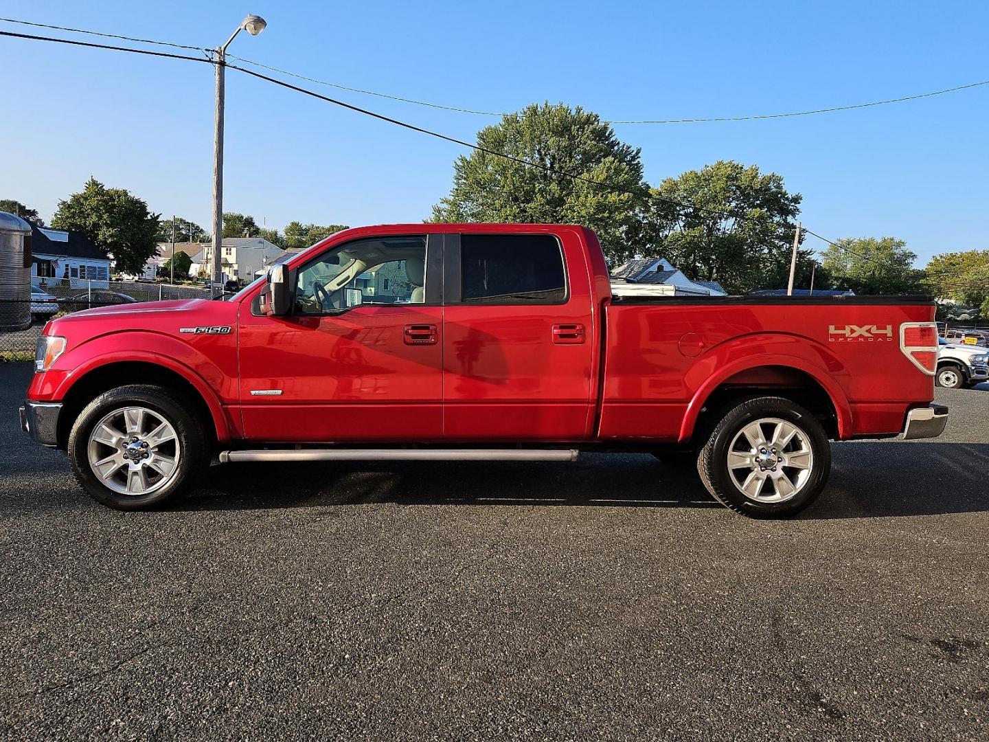 2011 Red Candy Metallic - RZ /Pale Adobe - EA Ford F-150 Lariat (1FTFW1ET9BF) with an 3.5L V6 ECOBOOST ENGINE engine, located at 50 Eastern Blvd., Essex, MD, 21221, (410) 686-3444, 39.304367, -76.484947 - Experience power, comfort and style with this stunning 2011 Ford F-150 Lariat 4WD Supercrew 157" Lariat. Showcasing a striking Red Candy Metallic-RZ exterior paired with a refined Pale Adobe-EA interior, this beast stands as a testament to Ford's superb craftsmanship. Under the hood lies a potent 3. - Photo#6