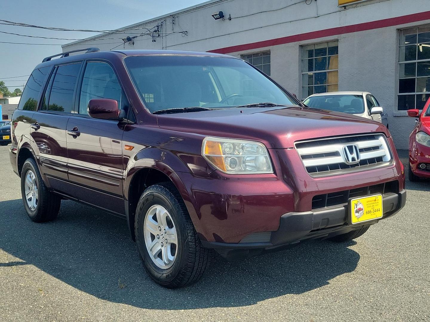 2008 Dark Cherry Pearl - RE /Gray - GR Honda Pilot VP (5FNYF182X8B) with an 3.5L SOHC MPFI 24-valve VTEC V6 engine engine, located at 50 Eastern Blvd., Essex, MD, 21221, (410) 686-3444, 39.304367, -76.484947 - Experience a superior ride with this gorgeous 2008 Honda Pilot VP, donned in a striking maroon exterior. This legendary SUV, equipped with a robust 3.5l SOHC MPFI 24-valve VTEC V6 engine, ensures a smooth yet spirited performance that Honda is renowned for. This 4WD marvel is designed for those who - Photo#2