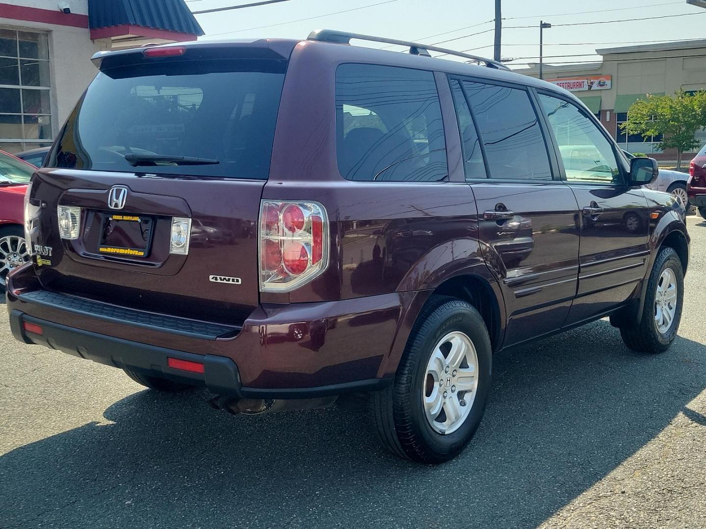 2008 Dark Cherry Pearl - RE /Gray - GR Honda Pilot VP (5FNYF182X8B) with an 3.5L SOHC MPFI 24-valve VTEC V6 engine engine, located at 50 Eastern Blvd., Essex, MD, 21221, (410) 686-3444, 39.304367, -76.484947 - Experience a superior ride with this gorgeous 2008 Honda Pilot VP, donned in a striking maroon exterior. This legendary SUV, equipped with a robust 3.5l SOHC MPFI 24-valve VTEC V6 engine, ensures a smooth yet spirited performance that Honda is renowned for. This 4WD marvel is designed for those who - Photo#3