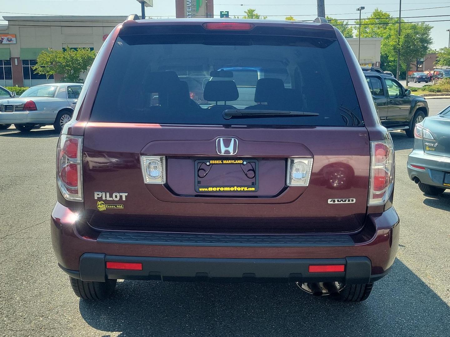 2008 Dark Cherry Pearl - RE /Gray - GR Honda Pilot VP (5FNYF182X8B) with an 3.5L SOHC MPFI 24-valve VTEC V6 engine engine, located at 50 Eastern Blvd., Essex, MD, 21221, (410) 686-3444, 39.304367, -76.484947 - Experience a superior ride with this gorgeous 2008 Honda Pilot VP, donned in a striking maroon exterior. This legendary SUV, equipped with a robust 3.5l SOHC MPFI 24-valve VTEC V6 engine, ensures a smooth yet spirited performance that Honda is renowned for. This 4WD marvel is designed for those who - Photo#4