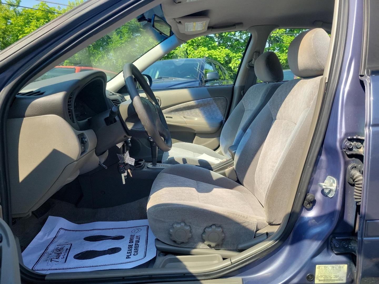 2000 Deja Blue Metallic - BT1 /Stone - X Nissan Sentra GXE (3N1CB51D2YL) with an 1.8L DOHC 16-valve 4-cyl engine engine, located at 50 Eastern Blvd., Essex, MD, 21221, (410) 686-3444, 39.304367, -76.484947 - Introducing the 2000 Nissan Sentra, a blend of performance, functionality, and style. This compact sedan, a standout in its class, boasts a stunning blue exterior that adds a pop of colour to its well-crafted aesthetic. The Sentra is equipped with advanced Japanese engineering known for reliability - Photo#12