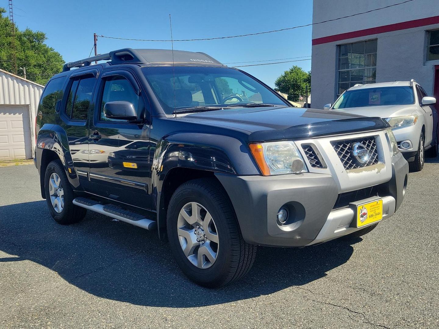 2009 Night Armor - K26 /Graphite - K Nissan Xterra SE (5N1AN08W69C) with an 4.0L DOHC 24-valve V6 engine w/continuous variable valve timing engine, located at 50 Eastern Blvd., Essex, MD, 21221, (410) 686-3444, 39.304367, -76.484947 - Presenting the distinguished 2009 Nissan Xterra, a superb blend of style, durability and efficiency. Coated in a subtle yet handsome gray exterior, the Xterra exudes an aura of sophistication. This powerful sports utility vehicle provides a superior driving experience with its robust framework and w - Photo#2