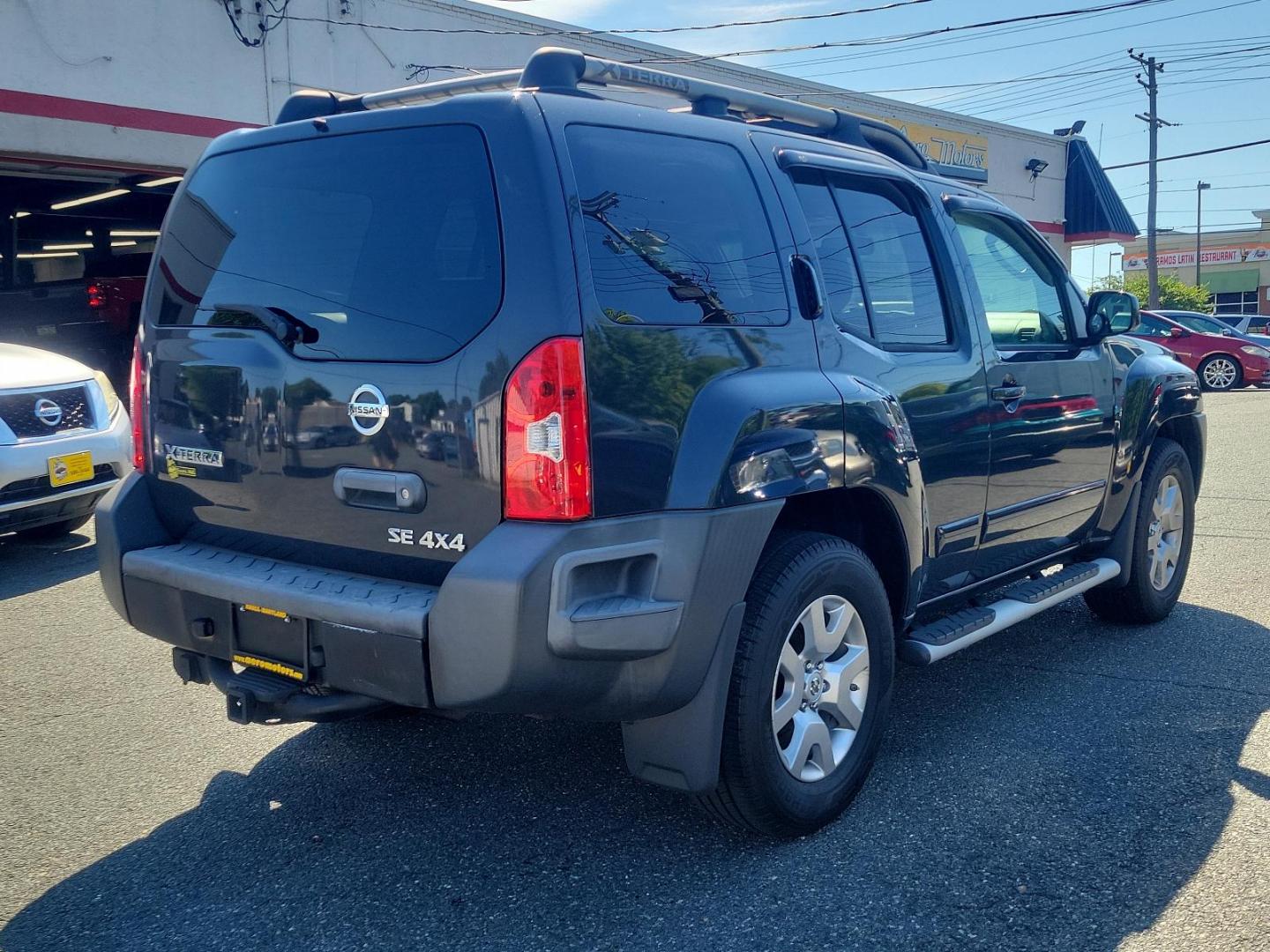 2009 Night Armor - K26 /Graphite - K Nissan Xterra SE (5N1AN08W69C) with an 4.0L DOHC 24-valve V6 engine w/continuous variable valve timing engine, located at 50 Eastern Blvd., Essex, MD, 21221, (410) 686-3444, 39.304367, -76.484947 - Presenting the distinguished 2009 Nissan Xterra, a superb blend of style, durability and efficiency. Coated in a subtle yet handsome gray exterior, the Xterra exudes an aura of sophistication. This powerful sports utility vehicle provides a superior driving experience with its robust framework and w - Photo#3