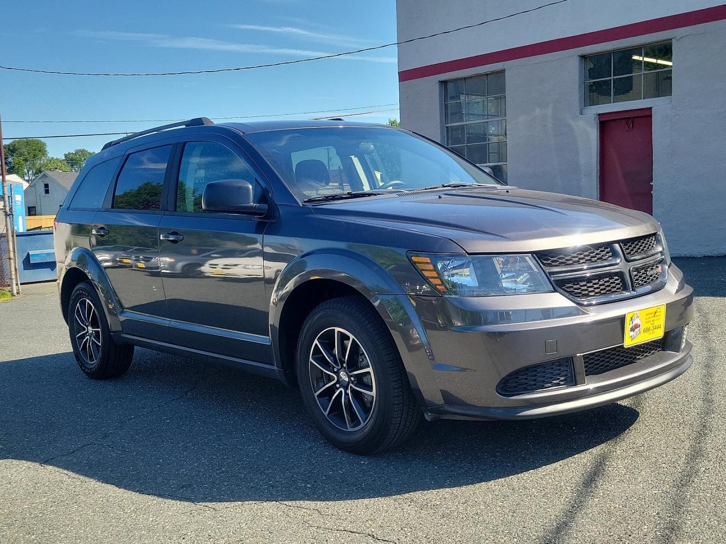 2017 Granite Pearlcoat - PAU /Black - E5X9 Dodge Journey SE (3C4PDCAB2HT) with an ENGINE: 2.4L I4 DOHC 16V DUAL VVT engine, located at 50 Eastern Blvd., Essex, MD, 21221, (410) 686-3444, 39.304367, -76.484947 - Experience the blend of style, comfort, and performance with the 2017 Dodge Journey SE with FWD. Encased in an elegant granite pearlcoat exterior, the car exudes a robust and sophisticated appeal. The interior is just as impressive with its immaculate black finish, reflecting a perfect blend of luxu - Photo#2