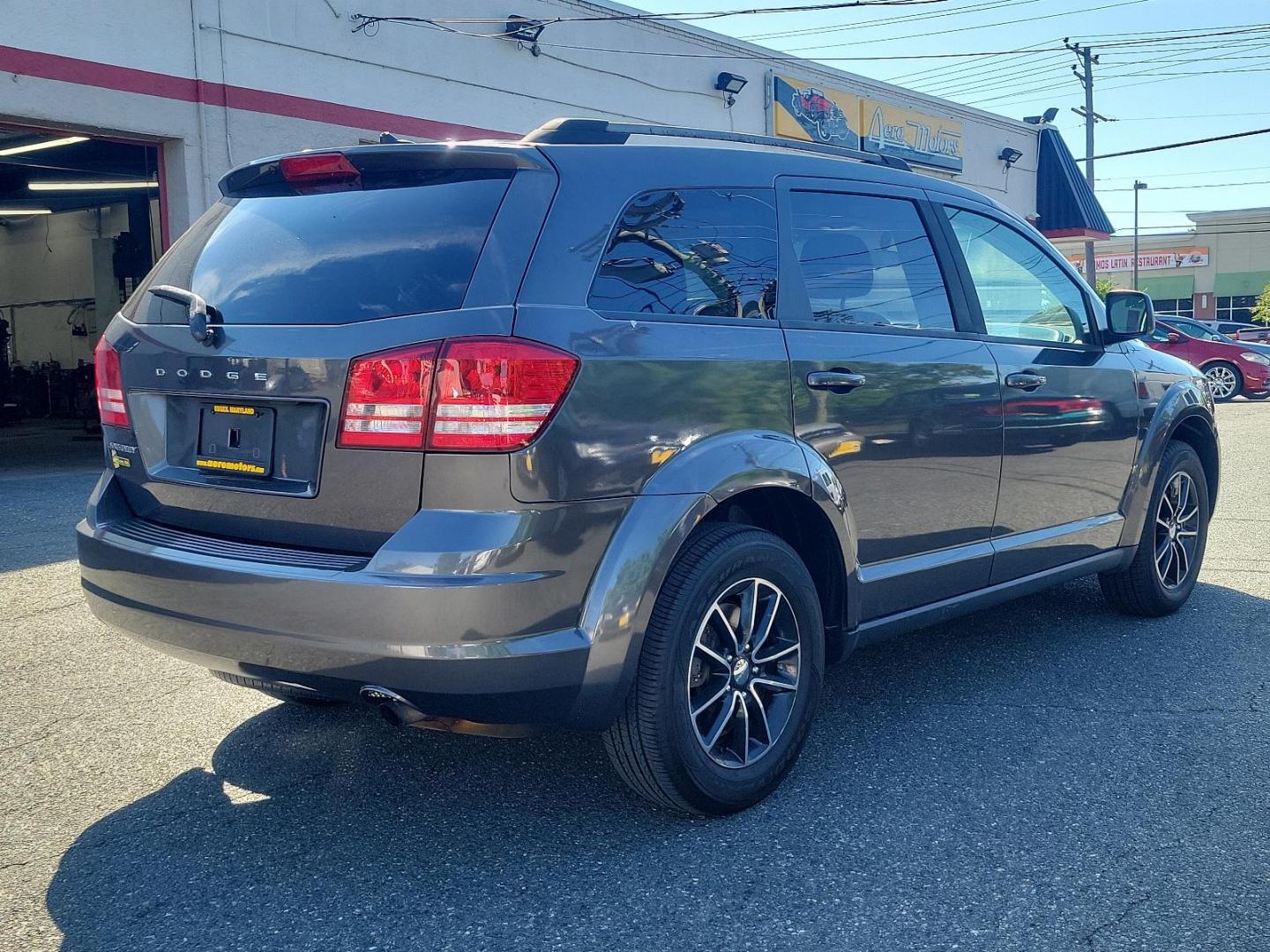 2017 Granite Pearlcoat - PAU /Black - E5X9 Dodge Journey SE (3C4PDCAB2HT) with an ENGINE: 2.4L I4 DOHC 16V DUAL VVT engine, located at 50 Eastern Blvd., Essex, MD, 21221, (410) 686-3444, 39.304367, -76.484947 - Experience the blend of style, comfort, and performance with the 2017 Dodge Journey SE with FWD. Encased in an elegant granite pearlcoat exterior, the car exudes a robust and sophisticated appeal. The interior is just as impressive with its immaculate black finish, reflecting a perfect blend of luxu - Photo#3