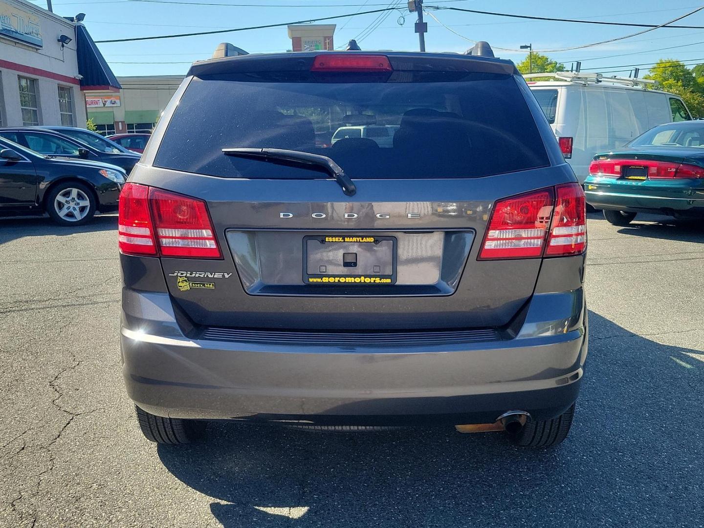 2017 Granite Pearlcoat - PAU /Black - E5X9 Dodge Journey SE (3C4PDCAB2HT) with an ENGINE: 2.4L I4 DOHC 16V DUAL VVT engine, located at 50 Eastern Blvd., Essex, MD, 21221, (410) 686-3444, 39.304367, -76.484947 - Experience the blend of style, comfort, and performance with the 2017 Dodge Journey SE with FWD. Encased in an elegant granite pearlcoat exterior, the car exudes a robust and sophisticated appeal. The interior is just as impressive with its immaculate black finish, reflecting a perfect blend of luxu - Photo#4