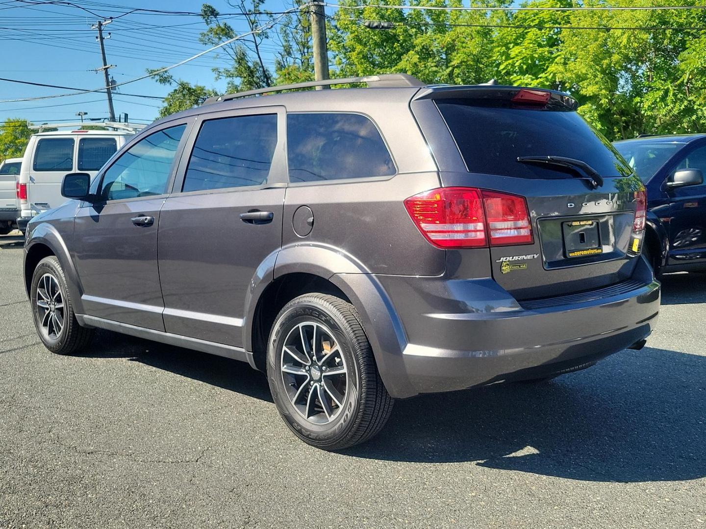 2017 Granite Pearlcoat - PAU /Black - E5X9 Dodge Journey SE (3C4PDCAB2HT) with an ENGINE: 2.4L I4 DOHC 16V DUAL VVT engine, located at 50 Eastern Blvd., Essex, MD, 21221, (410) 686-3444, 39.304367, -76.484947 - Experience the blend of style, comfort, and performance with the 2017 Dodge Journey SE with FWD. Encased in an elegant granite pearlcoat exterior, the car exudes a robust and sophisticated appeal. The interior is just as impressive with its immaculate black finish, reflecting a perfect blend of luxu - Photo#5