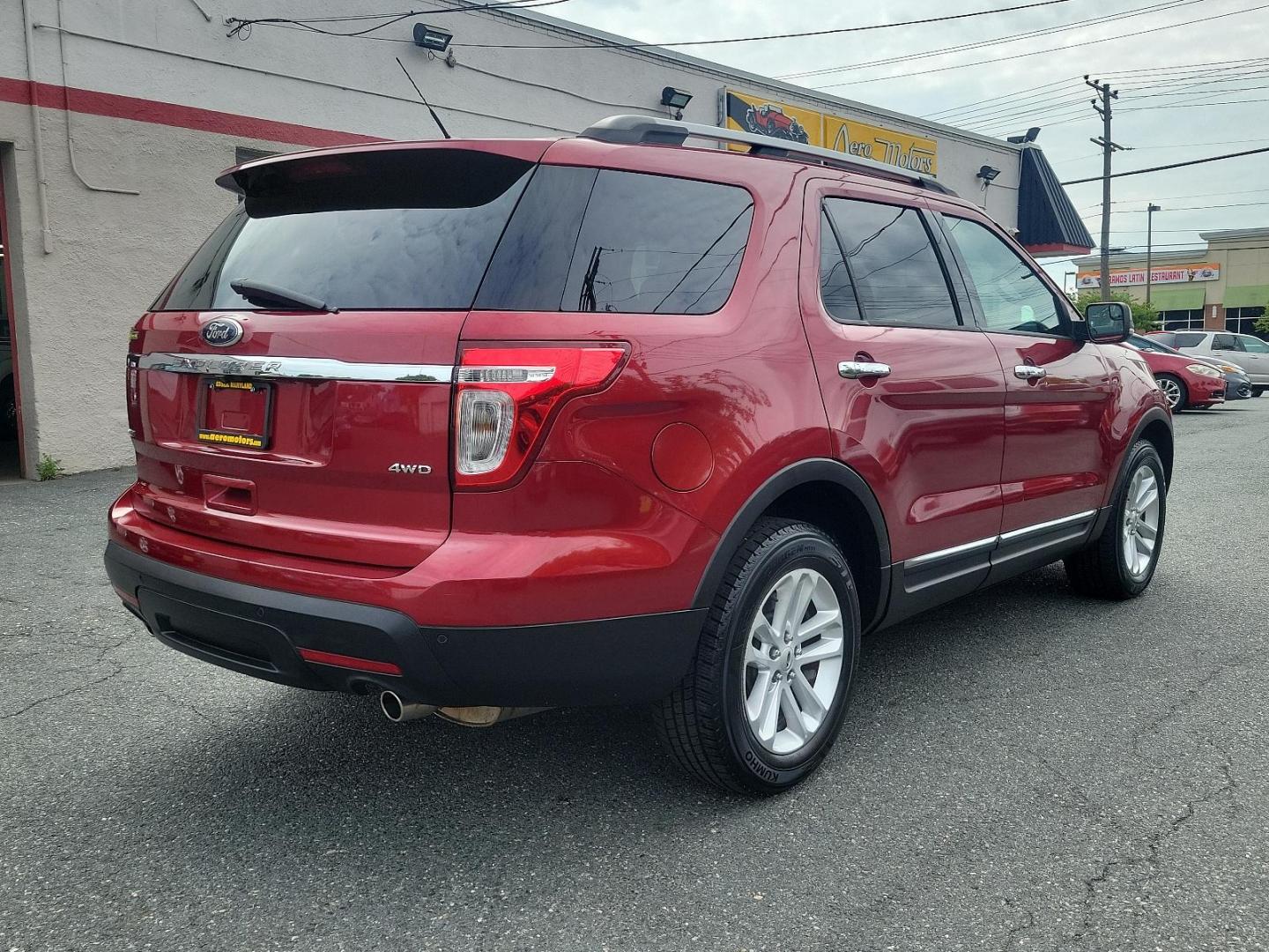 2014 Ruby Red Metallic Tinted Clearcoat - RR /Charcoal Black - 8W Ford Explorer XLT (1FM5K8D85EG) with an ENGINE: 3.5L TI-VCT V6 engine, located at 50 Eastern Blvd., Essex, MD, 21221, (410) 686-3444, 39.304367, -76.484947 - Step into the world of adventure with this immaculate 2014 Ford Explorer XLT 4WD 4DR. Impeccably mantained and bathed in striking Ruby Red metallic tinted clearcoat, this robust vehicle promises not only performance but style as well. Replete with a plush Charcoal Black interior, an aesthetic that f - Photo#3