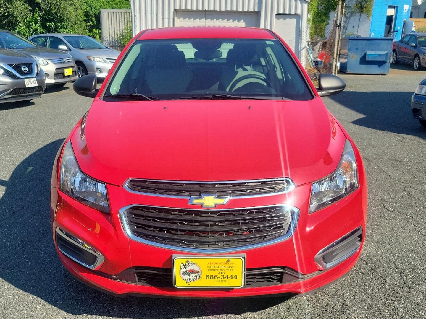 2015 Red Hot - G7C /Jet Black/Medium Titanium - AFB Chevrolet Cruze LS (1G1PA5SG4F7) with an ENGINE, ECOTEC 1.8L VARIABLE VALVE TIMING DOHC 4-CYLINDER SEQUENTIAL MFI engine, located at 50 Eastern Blvd., Essex, MD, 21221, (410) 686-3444, 39.304367, -76.484947 - Experience the ideal blend of performance, comfort, and style with our 2015 Chevrolet Cruze LS 4dr Sdn Auto LS. Brought to life in an eye-catching Red Hot - G7C exterior, this sleek sedan echoes sophistication. The interior is just as compelling, featuring a Jet Black/Medium Titanium - AFB that exud - Photo#1