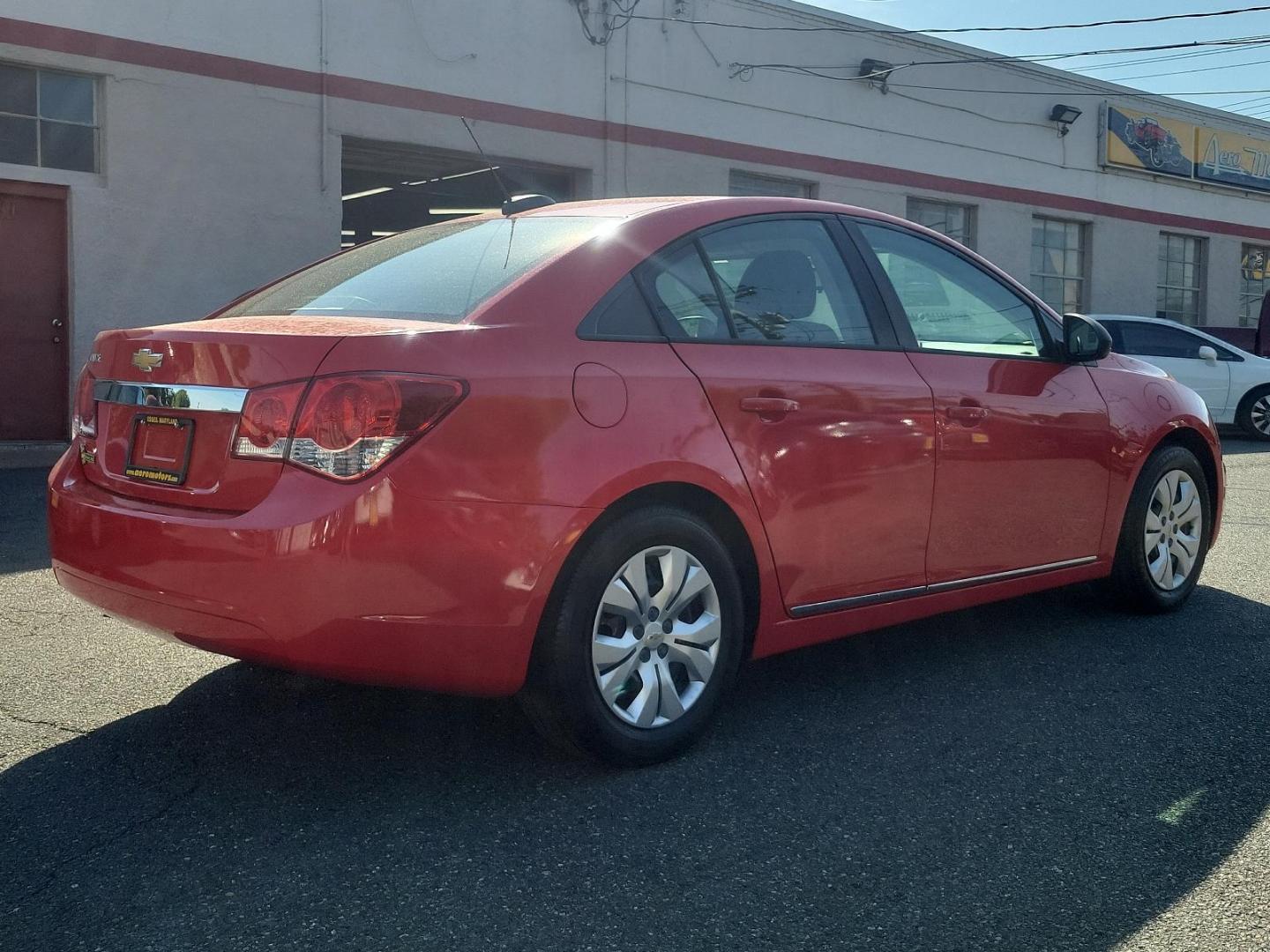 2015 Red Hot - G7C /Jet Black/Medium Titanium - AFB Chevrolet Cruze LS (1G1PA5SG4F7) with an ENGINE, ECOTEC 1.8L VARIABLE VALVE TIMING DOHC 4-CYLINDER SEQUENTIAL MFI engine, located at 50 Eastern Blvd., Essex, MD, 21221, (410) 686-3444, 39.304367, -76.484947 - Experience the ideal blend of performance, comfort, and style with our 2015 Chevrolet Cruze LS 4dr Sdn Auto LS. Brought to life in an eye-catching Red Hot - G7C exterior, this sleek sedan echoes sophistication. The interior is just as compelling, featuring a Jet Black/Medium Titanium - AFB that exud - Photo#3