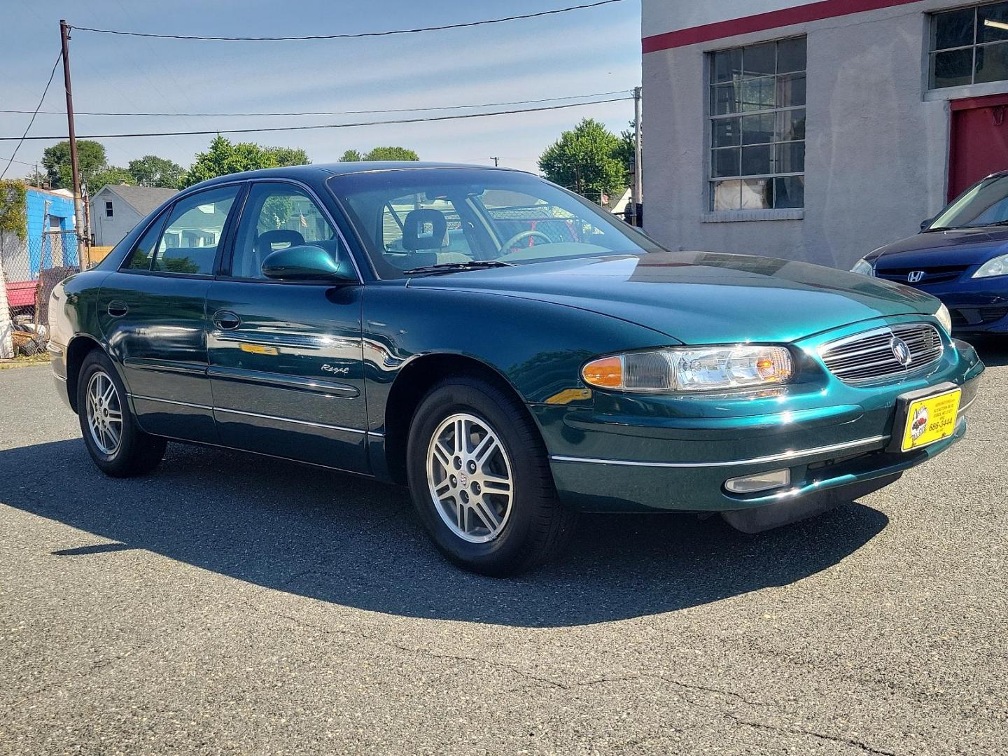 2000 Jasper Green Metallic - 56U /Medium Gray - 14 Buick Regal LS (2G4WB52KXY1) with an 3.8L (231) SFI V6 3800 SERIES II ENGINE engine, located at 50 Eastern Blvd., Essex, MD, 21221, (410) 686-3444, 39.304367, -76.484947 - Presenting the elegant 2000 Buick Regal LS 4dr, finished in a majestic Jasper Green Metallic - 56u exterior, complemented by a sophisticated Medium Gray - 14 interior, exuding an undeniable timeless charm. In its heart, lies an impressive 3.8L (231) SFI V6 3800 Series II engine, merging power and pe - Photo#2