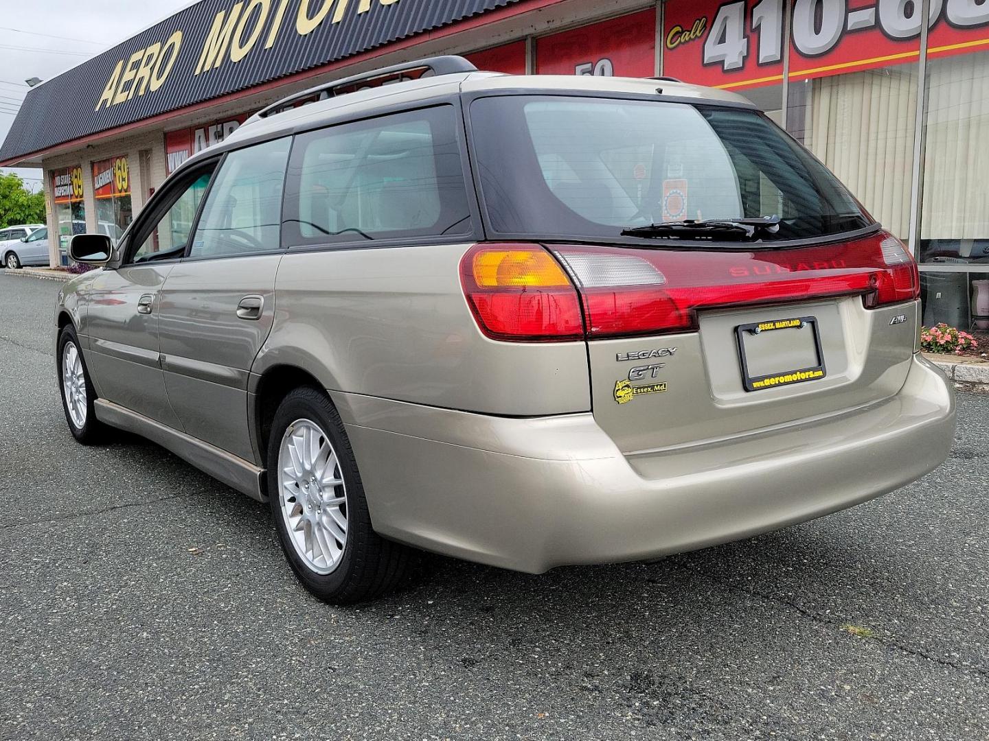 2002 Titanium Pearl - /Dark Gray - Subaru Legacy Wagon GT (4S3BH645527) with an 2.5L SOHC SMPI 16-valve 4-cyl horizontally opposed boxer engine engine, located at 50 Eastern Blvd., Essex, MD, 21221, (410) 686-3444, 39.304367, -76.484947 - Discover the joy of driving in this impressively maintained 2002 Subaru Legacy Wagon GT. Bathed in a sophisticated champagne exterior, this 5-door automatic vehicle boasts both style and durability. At its heart is a powerful 2.5L SOHC SMPI 16-valve 4-cylinder horizontally opposed boxer engine that - Photo#3