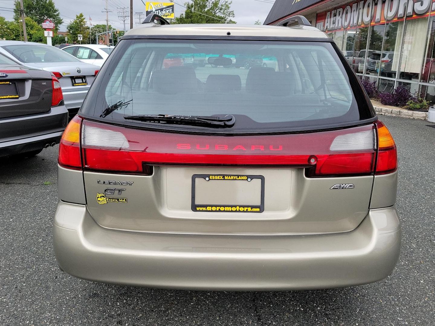 2002 Titanium Pearl - /Dark Gray - Subaru Legacy Wagon GT (4S3BH645527) with an 2.5L SOHC SMPI 16-valve 4-cyl horizontally opposed boxer engine engine, located at 50 Eastern Blvd., Essex, MD, 21221, (410) 686-3444, 39.304367, -76.484947 - Discover the joy of driving in this impressively maintained 2002 Subaru Legacy Wagon GT. Bathed in a sophisticated champagne exterior, this 5-door automatic vehicle boasts both style and durability. At its heart is a powerful 2.5L SOHC SMPI 16-valve 4-cylinder horizontally opposed boxer engine that - Photo#4