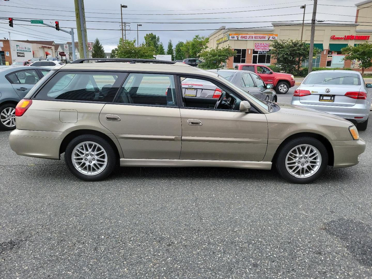 2002 Titanium Pearl - /Dark Gray - Subaru Legacy Wagon GT (4S3BH645527) with an 2.5L SOHC SMPI 16-valve 4-cyl horizontally opposed boxer engine engine, located at 50 Eastern Blvd., Essex, MD, 21221, (410) 686-3444, 39.304367, -76.484947 - Discover the joy of driving in this impressively maintained 2002 Subaru Legacy Wagon GT. Bathed in a sophisticated champagne exterior, this 5-door automatic vehicle boasts both style and durability. At its heart is a powerful 2.5L SOHC SMPI 16-valve 4-cylinder horizontally opposed boxer engine that - Photo#6