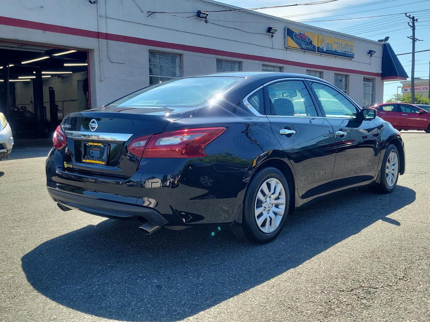 2018 Super Black - KH3 /Charcoal - G Nissan Altima 2.5 S (1N4AL3AP2JC) with an Engine: 2.5L DOHC 16-Valve 4-Cylinder engine, located at 50 Eastern Blvd., Essex, MD, 21221, (410) 686-3444, 39.304367, -76.484947 - Immerse yourself in the refined styling of our 2018 Nissan Altima 2.5 S Sedan, showcased in a stunning Super Black - KH3 exterior paired with a plush Charcoal - G interior. Under its sleek hood, this sedan hosts a powerful 2.5L DOHC 16-Valve 4-Cylinder engine that offers unmatched performance and ef - Photo#3