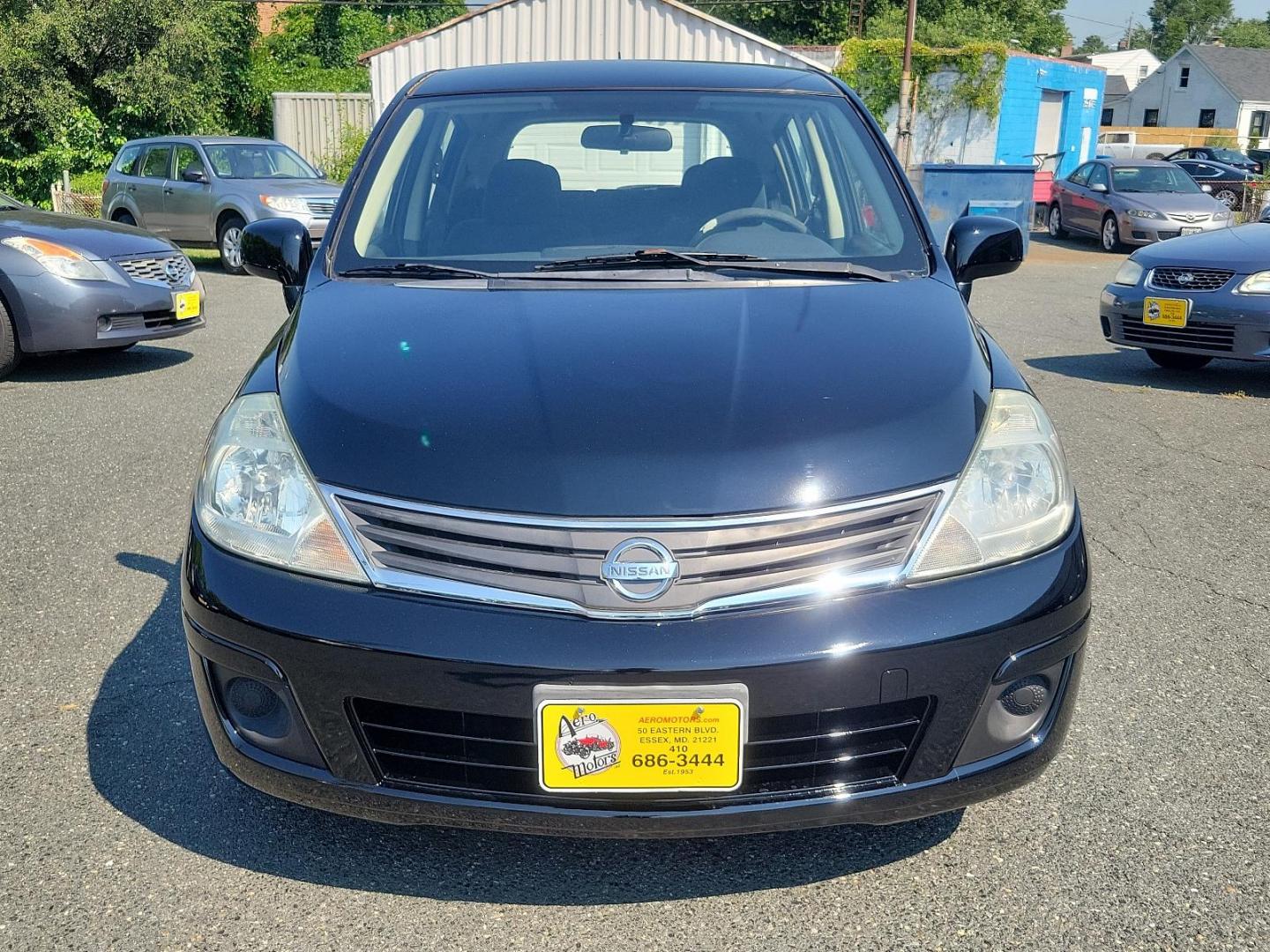 2010 Super Black - KH3 /Charcoal - G Nissan Versa 1.8 S (3N1BC1CP3AL) with an 1.8L DOHC 16-valve CVTCS I4 engine engine, located at 50 Eastern Blvd., Essex, MD, 21221, (410) 686-3444, 39.304367, -76.484947 - Meet the 2010 Nissan Versa 1.8 S 5DR HB I4 Auto 1.8 S, a sophisticated blend of performance, efficiency, and style. Powered by a 1.8L DOHC 16-valve CVTCS I4 engine, this dynamo exudes confidence on every road exerting unrivaled horsepower and torque. Its Super Black - KH3 exterior is a testament to - Photo#1