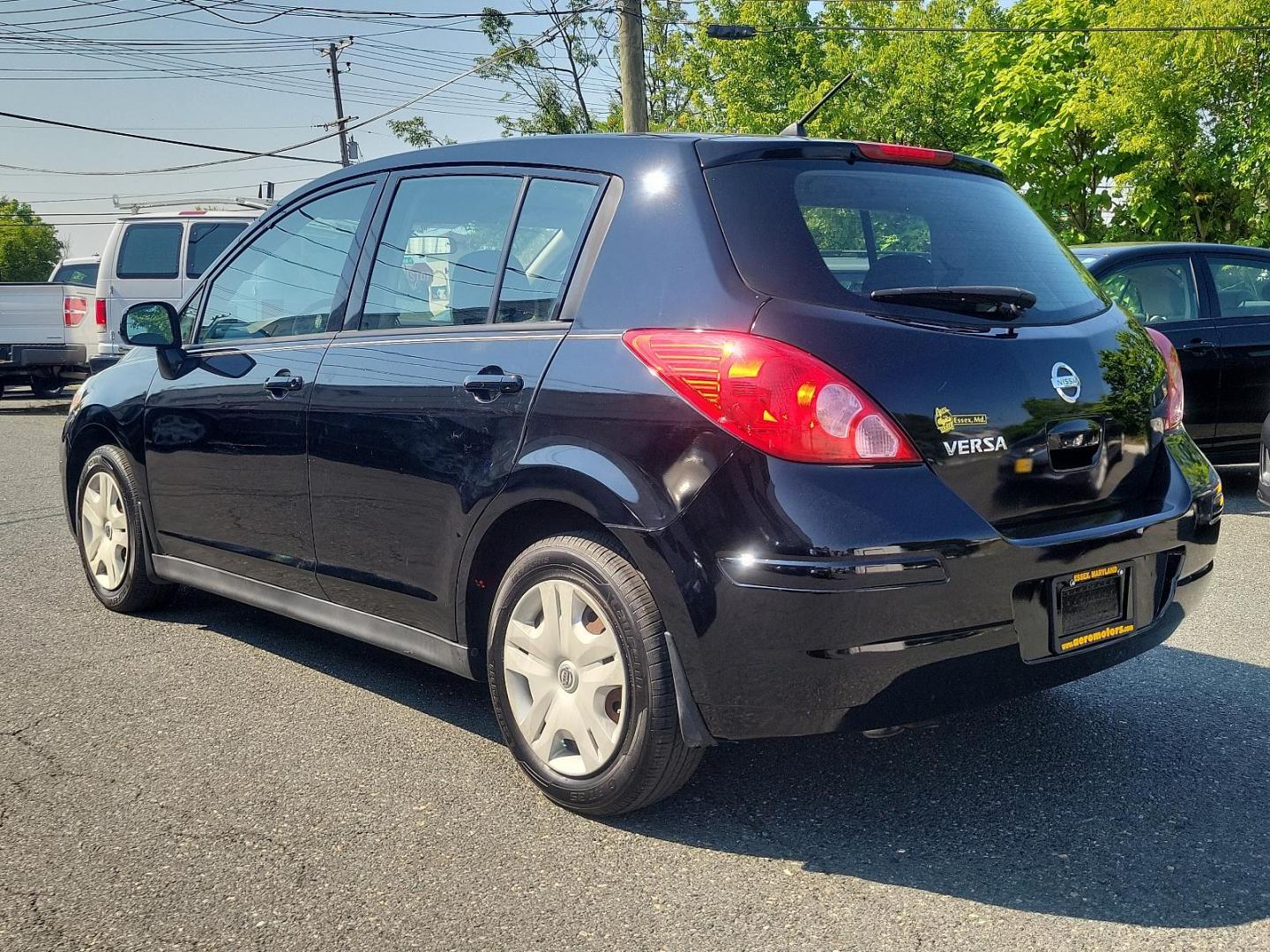 2010 Super Black - KH3 /Charcoal - G Nissan Versa 1.8 S (3N1BC1CP3AL) with an 1.8L DOHC 16-valve CVTCS I4 engine engine, located at 50 Eastern Blvd., Essex, MD, 21221, (410) 686-3444, 39.304367, -76.484947 - Meet the 2010 Nissan Versa 1.8 S 5DR HB I4 Auto 1.8 S, a sophisticated blend of performance, efficiency, and style. Powered by a 1.8L DOHC 16-valve CVTCS I4 engine, this dynamo exudes confidence on every road exerting unrivaled horsepower and torque. Its Super Black - KH3 exterior is a testament to - Photo#5