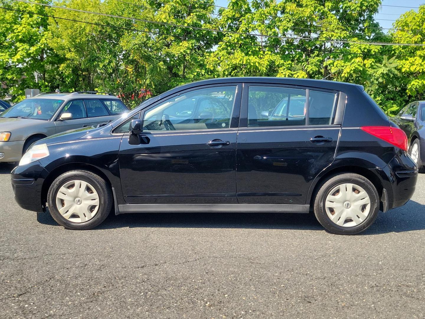 2010 Super Black - KH3 /Charcoal - G Nissan Versa 1.8 S (3N1BC1CP3AL) with an 1.8L DOHC 16-valve CVTCS I4 engine engine, located at 50 Eastern Blvd., Essex, MD, 21221, (410) 686-3444, 39.304367, -76.484947 - Meet the 2010 Nissan Versa 1.8 S 5DR HB I4 Auto 1.8 S, a sophisticated blend of performance, efficiency, and style. Powered by a 1.8L DOHC 16-valve CVTCS I4 engine, this dynamo exudes confidence on every road exerting unrivaled horsepower and torque. Its Super Black - KH3 exterior is a testament to - Photo#6