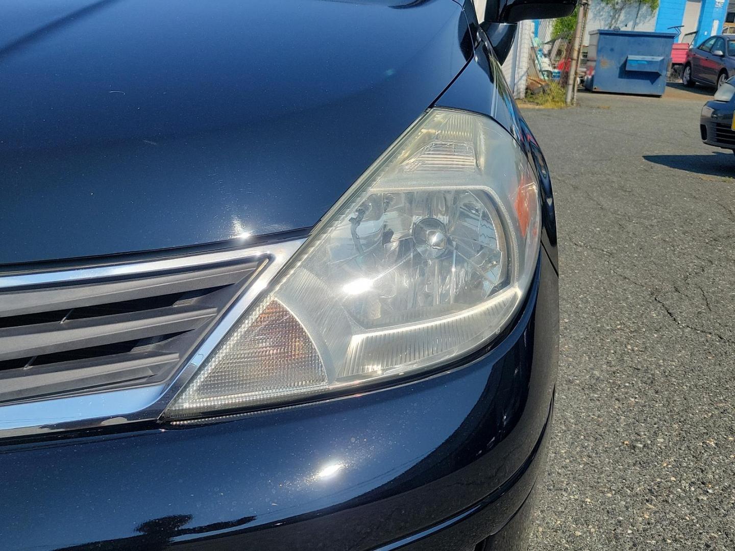 2010 Super Black - KH3 /Charcoal - G Nissan Versa 1.8 S (3N1BC1CP3AL) with an 1.8L DOHC 16-valve CVTCS I4 engine engine, located at 50 Eastern Blvd., Essex, MD, 21221, (410) 686-3444, 39.304367, -76.484947 - Meet the 2010 Nissan Versa 1.8 S 5DR HB I4 Auto 1.8 S, a sophisticated blend of performance, efficiency, and style. Powered by a 1.8L DOHC 16-valve CVTCS I4 engine, this dynamo exudes confidence on every road exerting unrivaled horsepower and torque. Its Super Black - KH3 exterior is a testament to - Photo#8