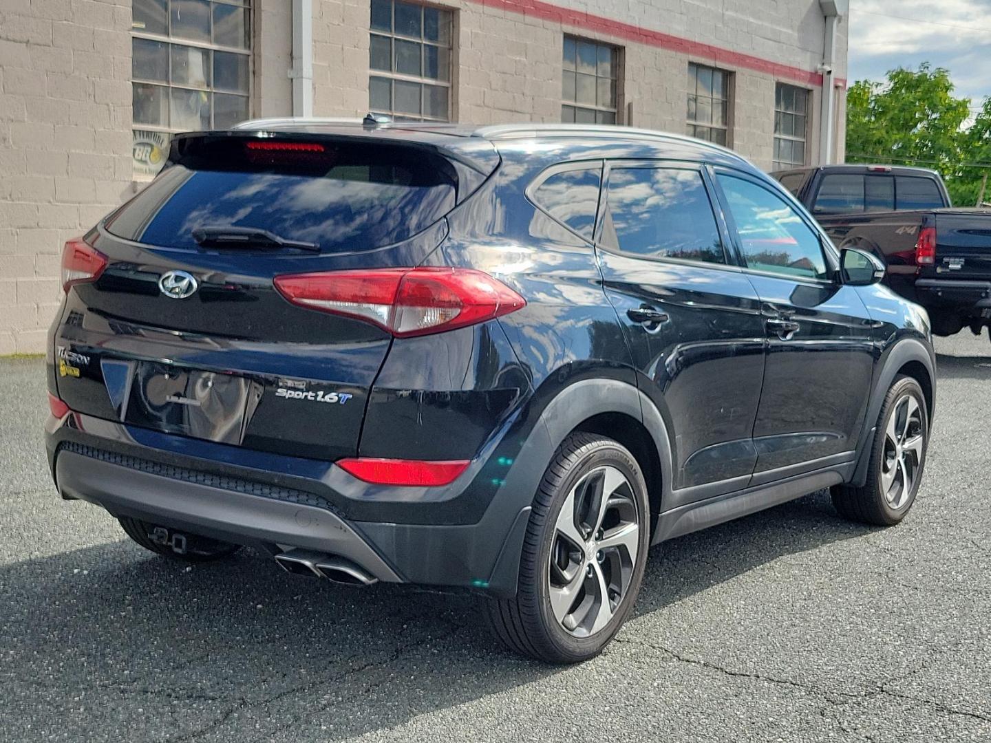 2016 Ash Black - TCM /Black - TRY Hyundai Tucson Sport (KM8J33A27GU) with an Engine: 1.6L GDI Turbo 4-Cylinder engine, located at 50 Eastern Blvd., Essex, MD, 21221, (410) 686-3444, 39.304367, -76.484947 - Experience the perfect blend of performance, comfort, and style with this carefully maintained 2016 Hyundai Tucson Sport FWD 4dr sport. Adorned in a timeless Ash Black exterior, this car stands out with its sleek, modern design. Inside, you're greeted with a matching black interior that exudes an au - Photo#5