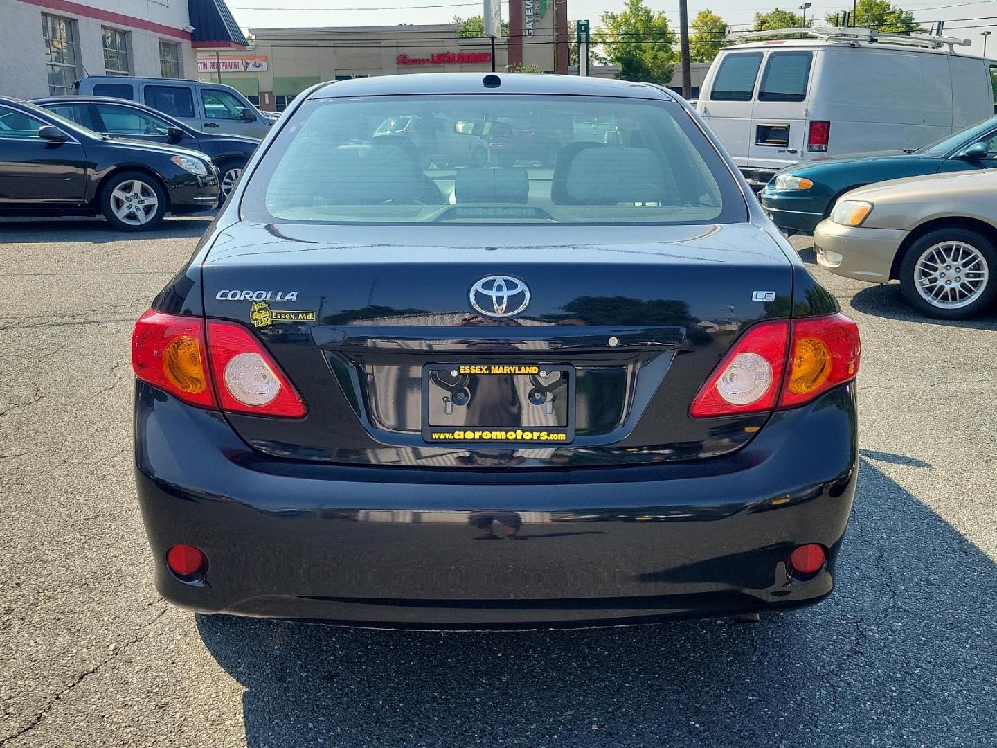 2010 Black Sand Pearl - 209 /Ash - FC16 Toyota Corolla LE (2T1BU4EE5AC) with an 1.8L DOHC SFI 16-valve VVT-i 4-cyl engine engine, located at 50 Eastern Blvd., Essex, MD, 21221, (410) 686-3444, 39.304367, -76.484947 - Introducing the sophisticated 2010 Toyota Corolla LE 4dr sedan, finished in a stunning Black Sand Pearl - 209 exterior that's perfectly complemented by an Ash - FC16 interior. Powered by a fuel-efficient 1.8L DOHC SFI 16-valve VVT-I 4-cylinder engine, this sleek vehicle masterfully combines performa - Photo#4