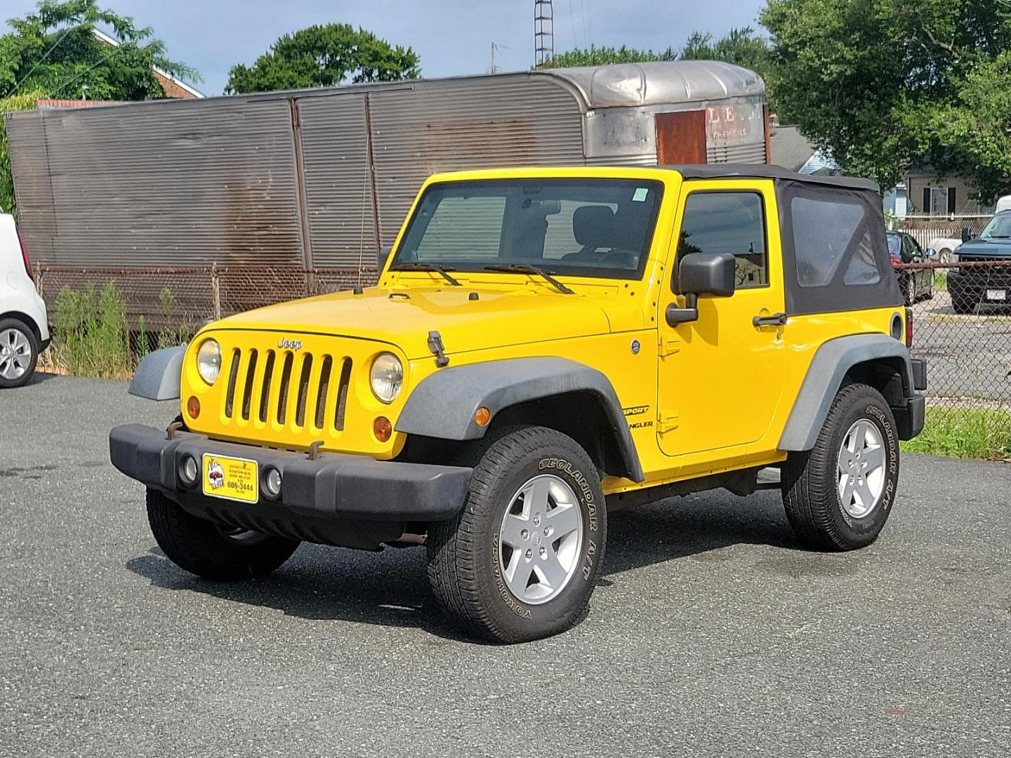 2011 Detonator Yellow Clear Coat - PYB /Black Interior - A7X9 Jeep Wrangler Sport (1J4AA2D13BL) with an 3.8L SMPI V6 ENGINE engine, located at 50 Eastern Blvd., Essex, MD, 21221, (410) 686-3444, 39.304367, -76.484947 - Experience the true joy of driving with this rugged 2011 Jeep Wrangler Sport 4WD 2dr Sport, finished in stunning Detonator Yellow Clear Coat. This classic off-road icon pairs beautifully with a sleek black interior, offering a striking contrast that is guaranteed to turn heads. Under the hood you'll - Photo#1