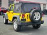 2011 Detonator Yellow Clear Coat - PYB /Black Interior - A7X9 Jeep Wrangler Sport (1J4AA2D13BL) with an 3.8L SMPI V6 ENGINE engine, located at 50 Eastern Blvd., Essex, MD, 21221, (410) 686-3444, 39.304367, -76.484947 - Experience the true joy of driving with this rugged 2011 Jeep Wrangler Sport 4WD 2dr Sport, finished in stunning Detonator Yellow Clear Coat. This classic off-road icon pairs beautifully with a sleek black interior, offering a striking contrast that is guaranteed to turn heads. Under the hood you'll - Photo#2