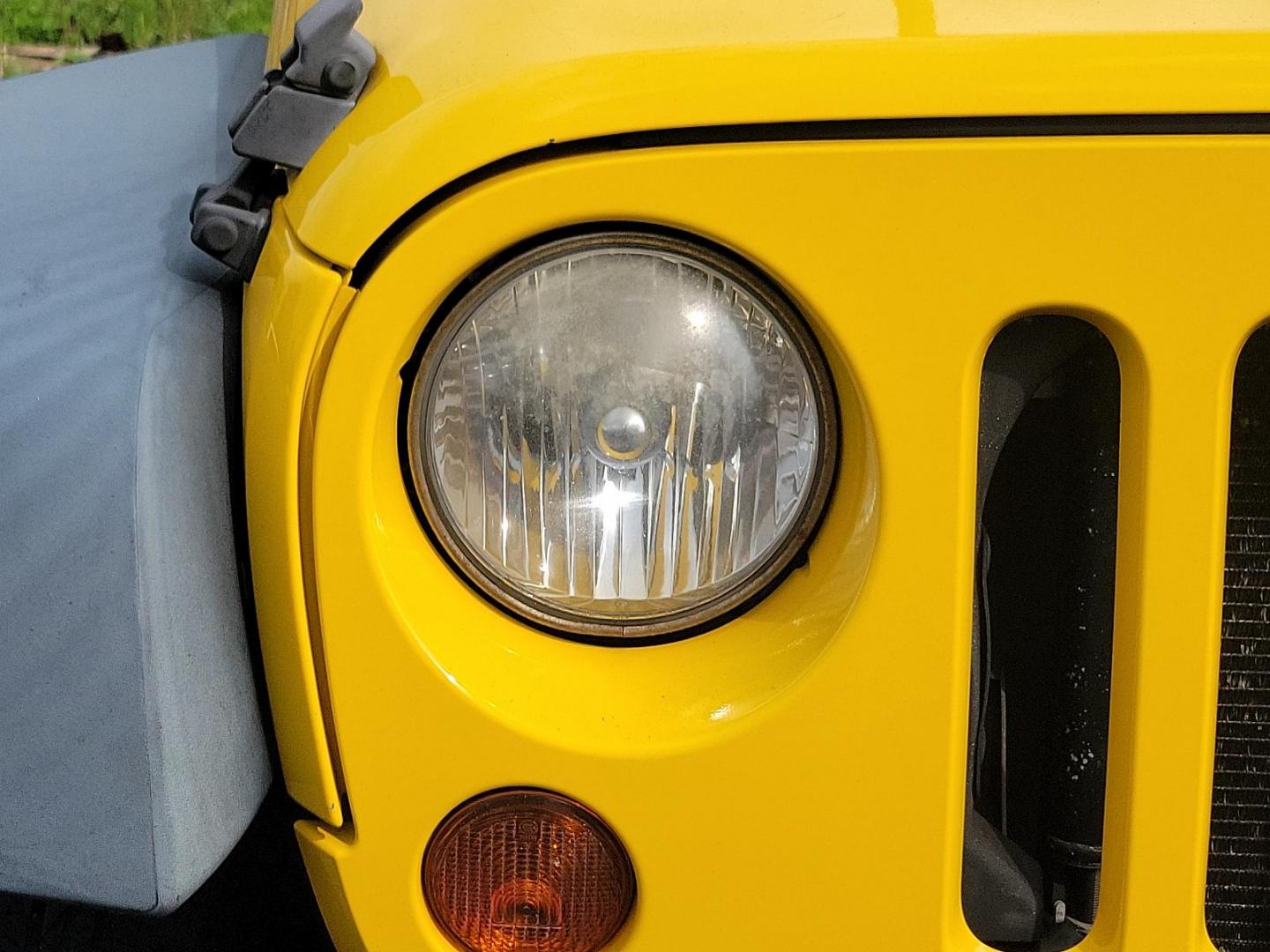 2011 Detonator Yellow Clear Coat - PYB /Black Interior - A7X9 Jeep Wrangler Sport (1J4AA2D13BL) with an 3.8L SMPI V6 ENGINE engine, located at 50 Eastern Blvd., Essex, MD, 21221, (410) 686-3444, 39.304367, -76.484947 - Experience the true joy of driving with this rugged 2011 Jeep Wrangler Sport 4WD 2dr Sport, finished in stunning Detonator Yellow Clear Coat. This classic off-road icon pairs beautifully with a sleek black interior, offering a striking contrast that is guaranteed to turn heads. Under the hood you'll - Photo#6